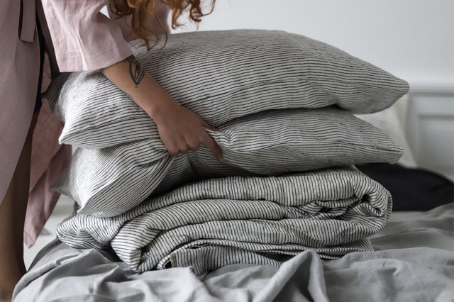 Making the bed was never so much fun. Organic linen bed sheets in black and white pin strip.