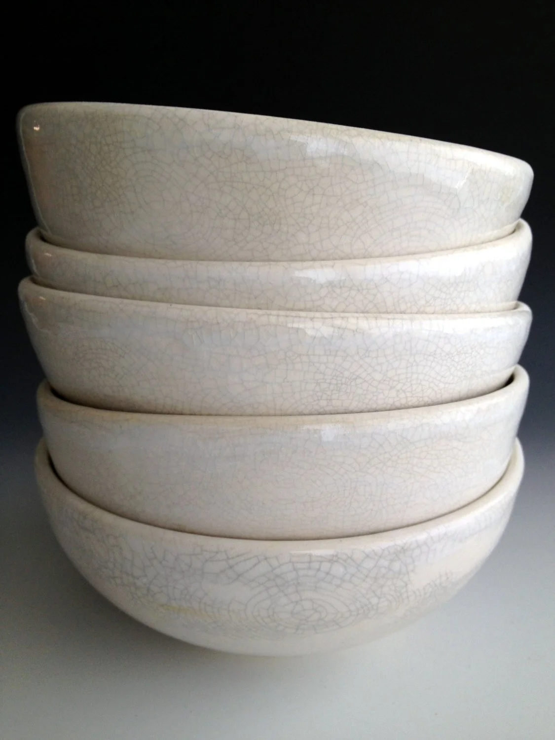 Stacked crackle hand thrown bowls , make everything we eat more beautiful. Hand made on Martha’s Vineyard.
