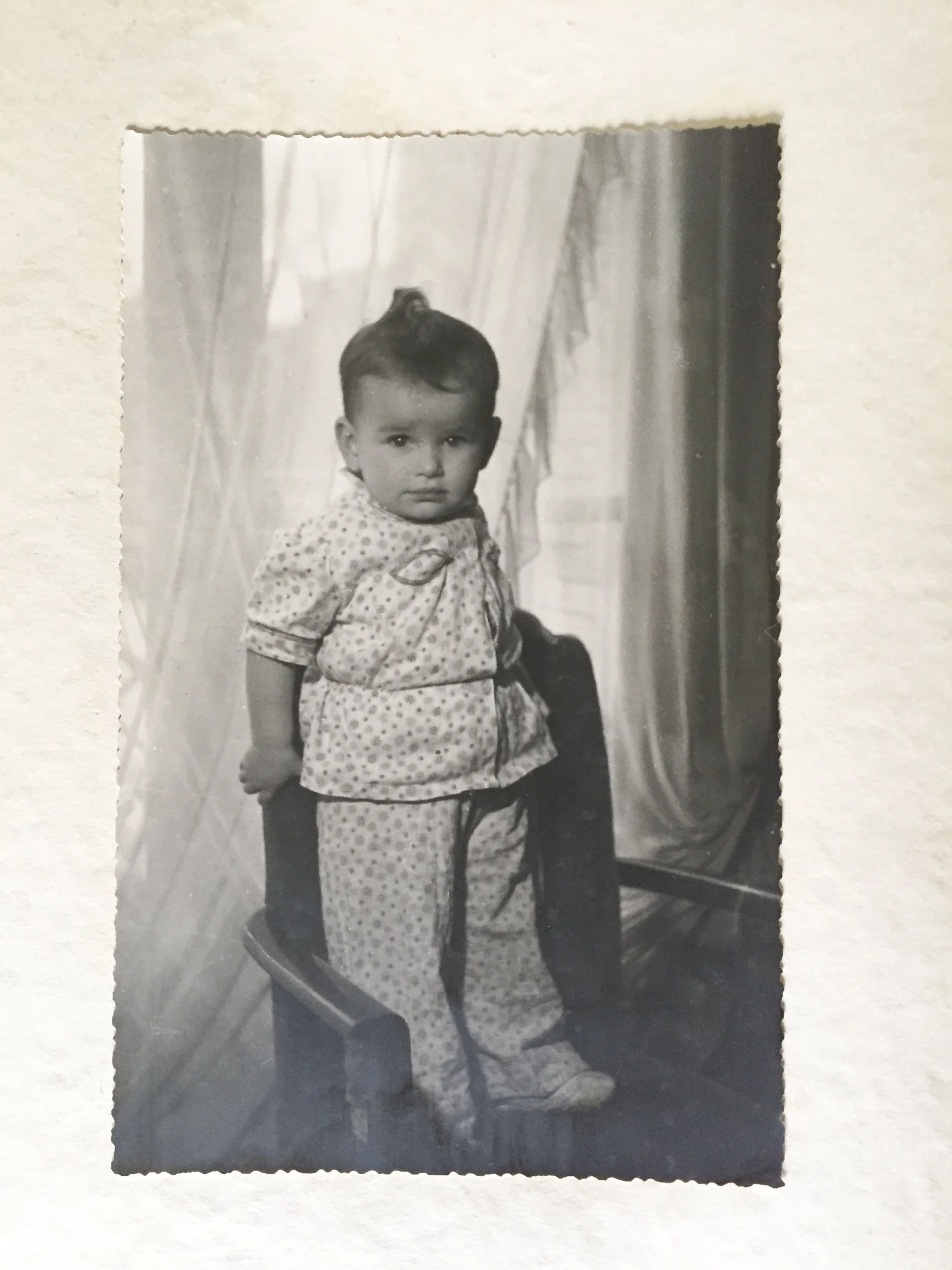 Janine Janowski pictued at 1-year-old in her home in Paris, France. (Photo: Muriel Hasbun archive.)