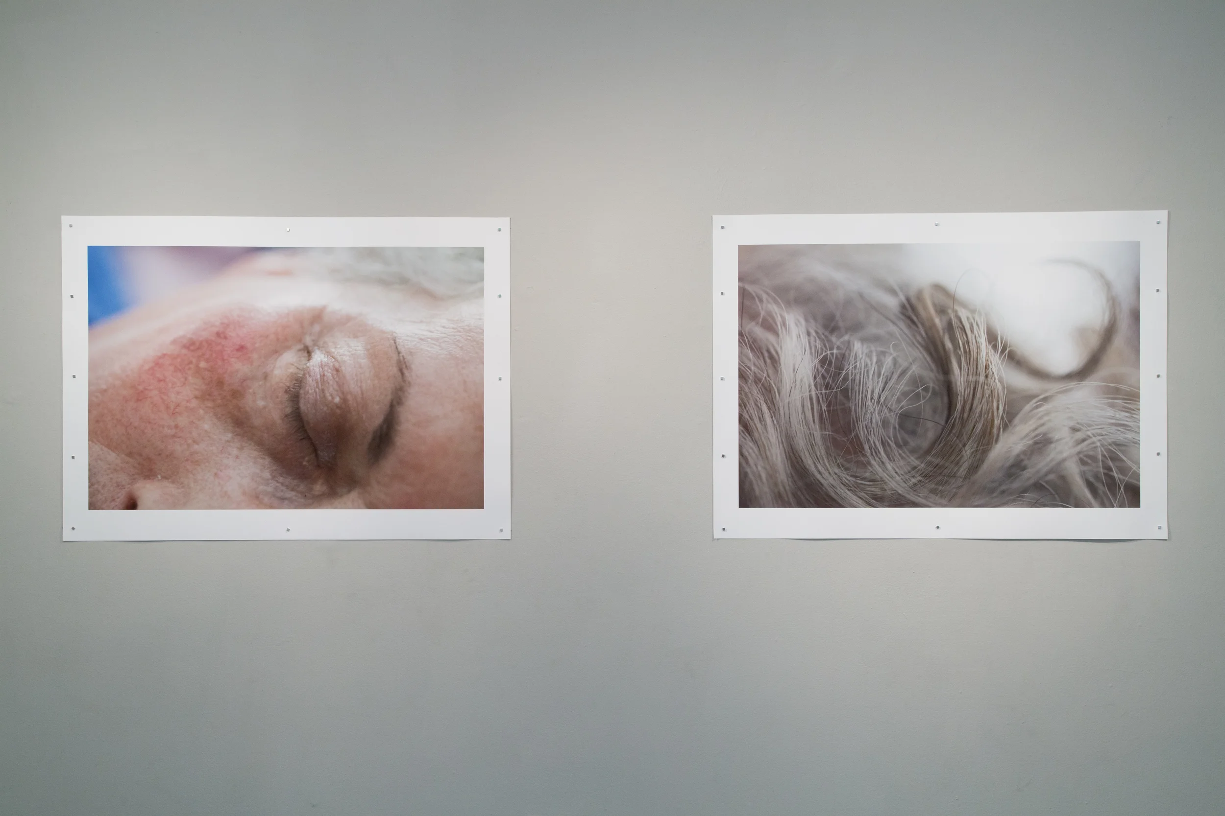 Photographs of Janine's last days hanging at the Cultural Center of Spain as part of an exhibition about the gallery and her legacy in El Salvador. Photographs by Muriel Hasbun.
