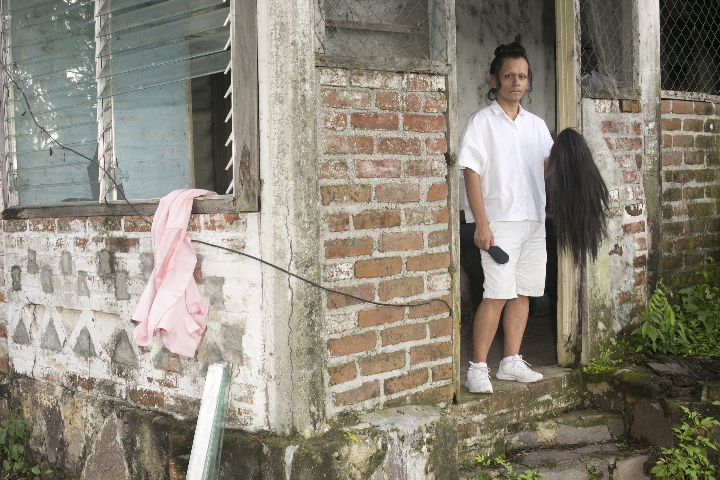 NadiA lives in Soyapango, the poorest and most dangerous city in El Salvador. Her house is only a few blocks from the invisible border between the MS 13 and 18th Street gangs. The border areas are notoriously violent because of long held turf wars. One misstep and she could die. Gang violence overwhelms her life but the irony is that there are more gay people in El Salvador than gang members — about 100,000 gay people and only 60,000 gang members.