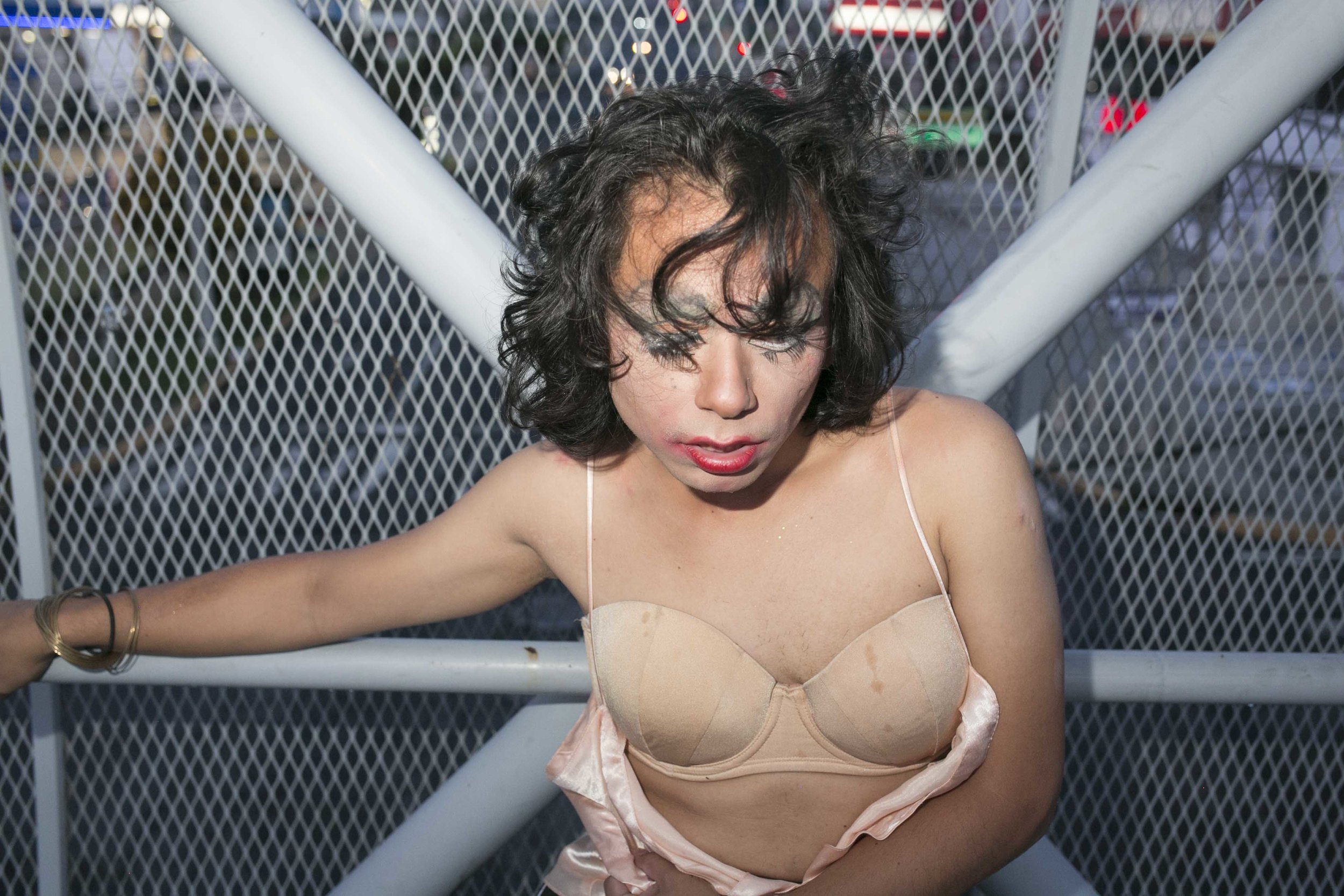 It was dawn in San Salvador and NadiA was half passed out in an above ground passageway; make-up smeared across her face, her ripped silky pink camisole revealing her prickly haired chest and sweat stained bra. NadiA frequently finds herself looking for somewhere safe to rest after long, long nights in the streets. One human rights report found that gangs often required new recruits to attack members of the LGBTQIA community as part of their initiation process. Members of the LGBTQIA community believe they are a particularly easy target for violence because perpetrators know police are less likely to investigate those crimes.