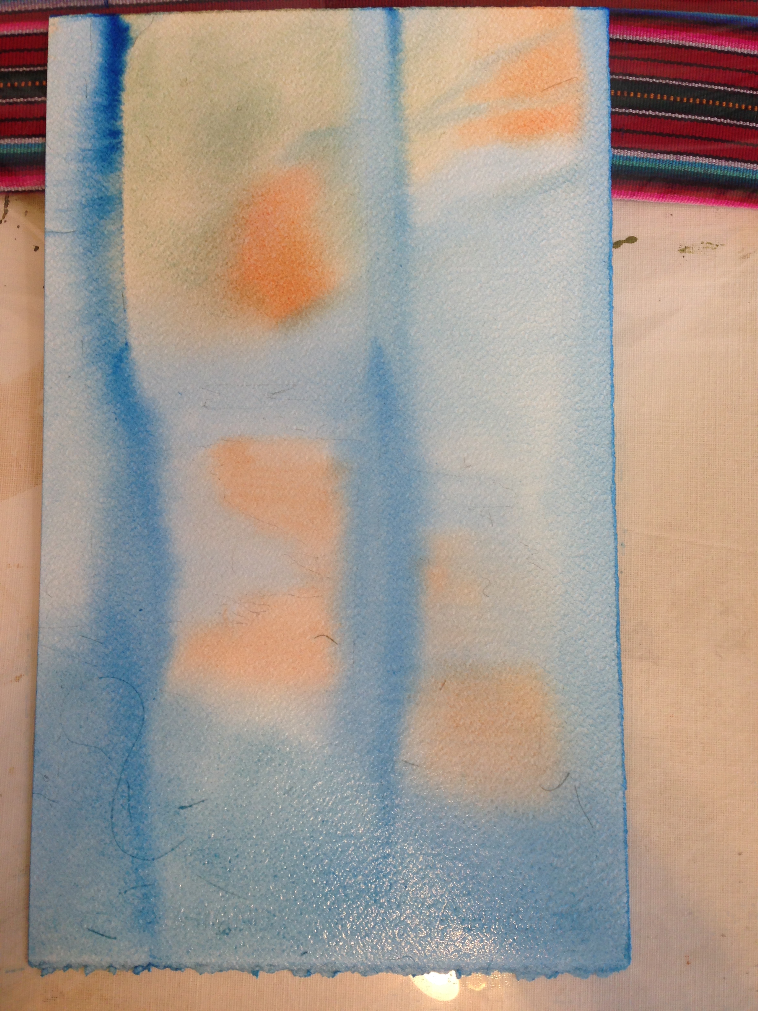 the blue and the opposing orange are much cleaner this time. The blue is also much greener. 