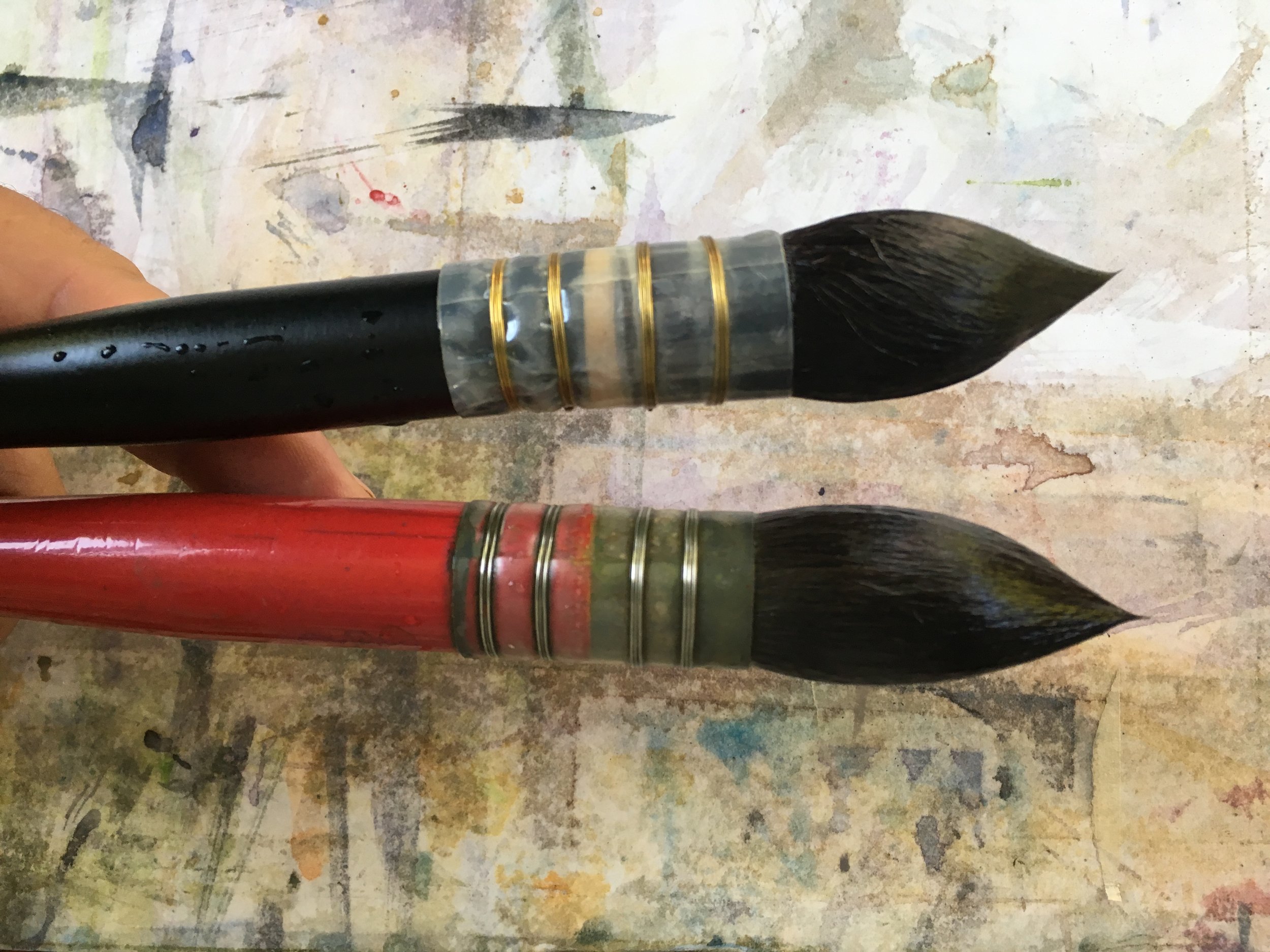 black rekab #12 (.75" wide) versus a big #10 Castagnet (.8" wide)
