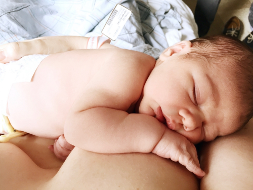 My first "breastfeeding" photo taken the morning after Noam was born. He'd just finished nursing and fell asleep, and I still couldn't believe what I was holding in my arms.