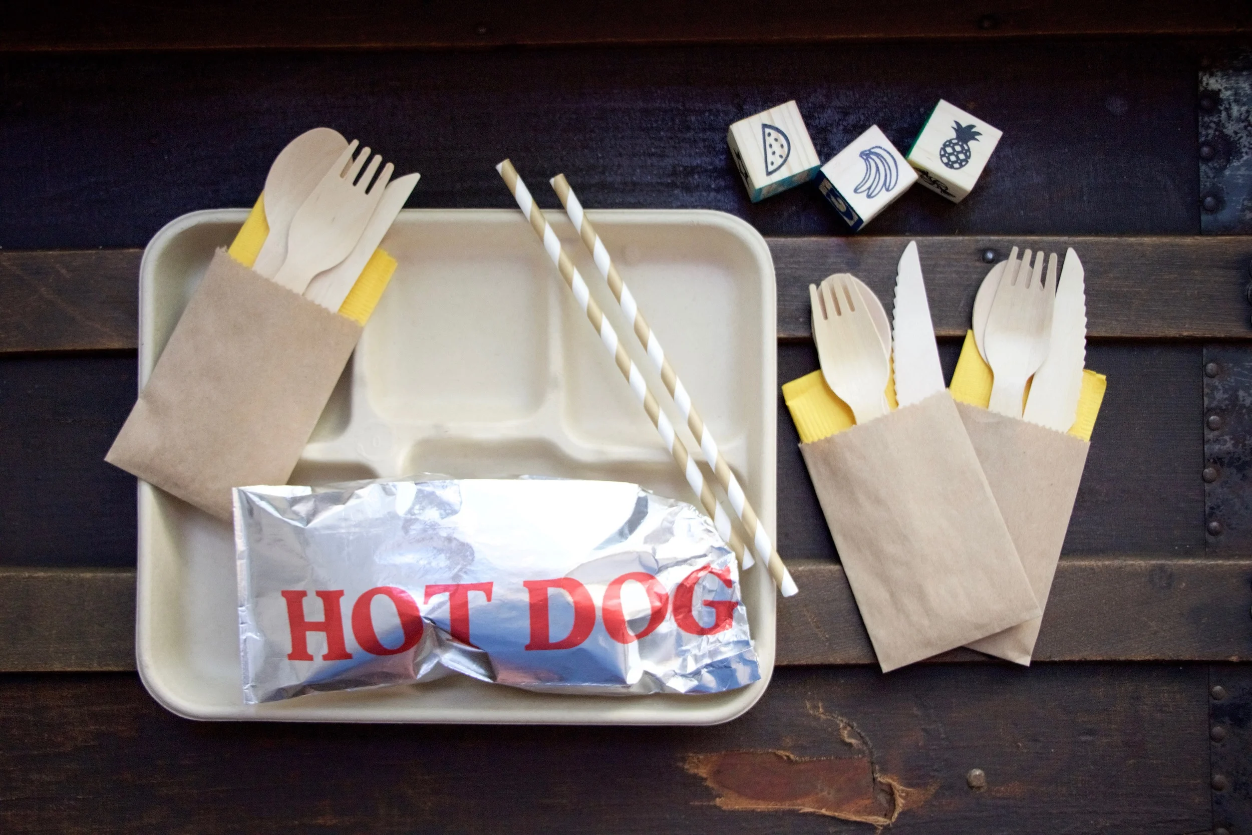 Lunch trays and hot dog foil bags: Outside the Box Papers , Wooden utensils and kraft bags: Piper Grace Supply Co.