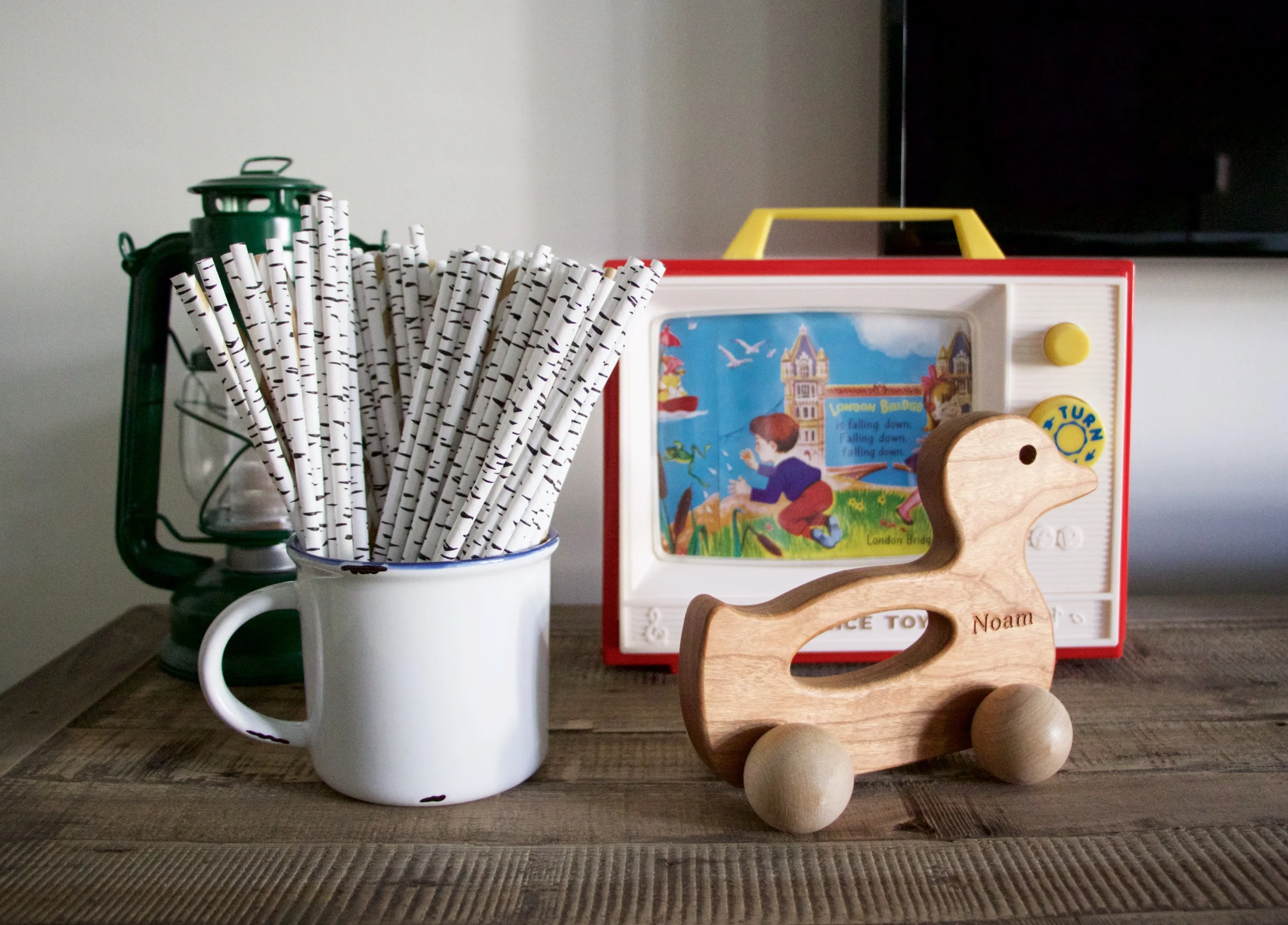 Lantern: Amazon, Birch straws: Nothing But Parties , Toy TV: Fisher-Price Classics, Personalized Duck toy: Bannor Toys