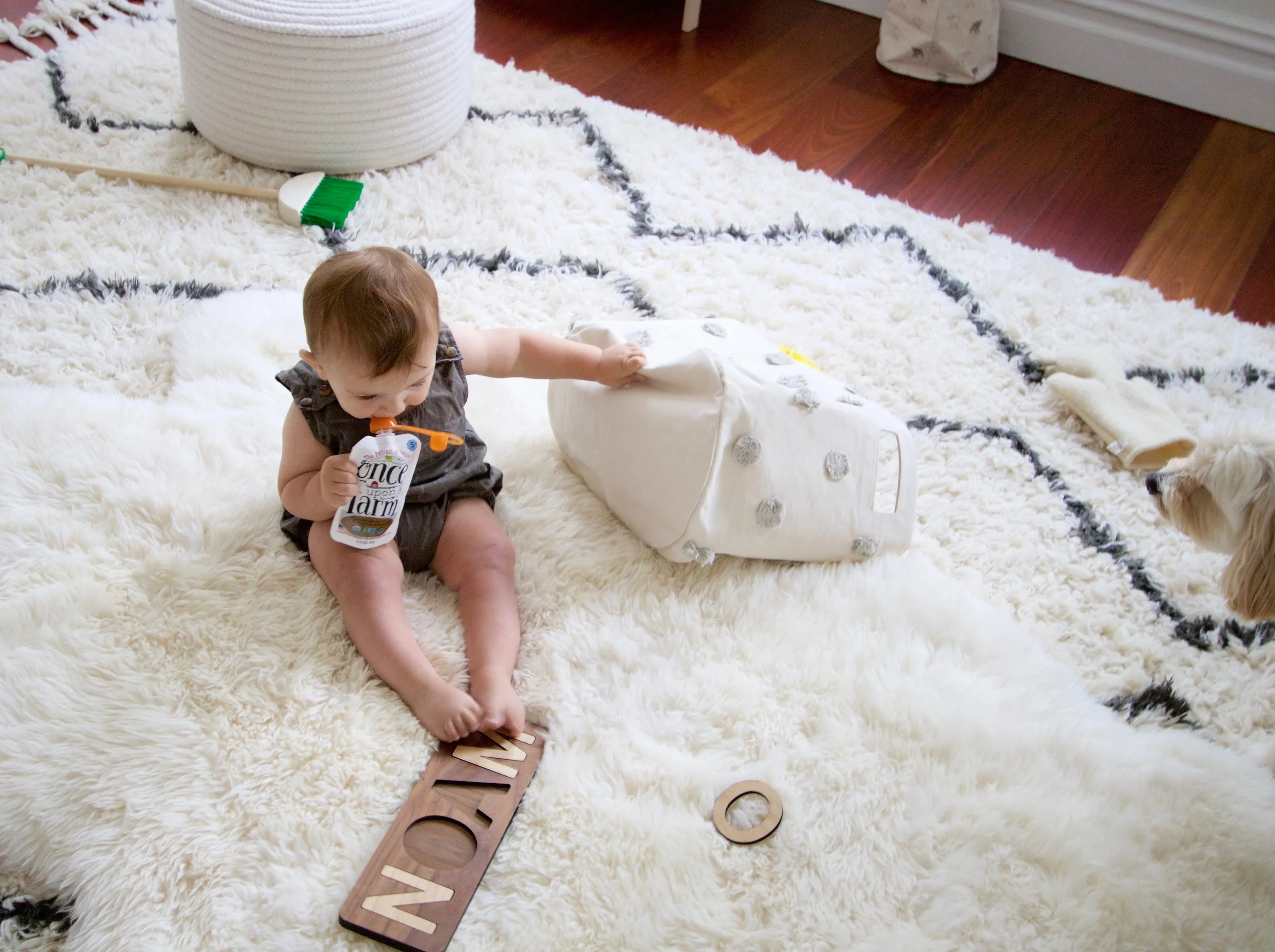 Noam is wearing the Rylee and Cru licorice romper . 