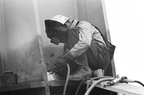 Welder_working_on_Space_Needle_leg_ca_July_1961.jpg