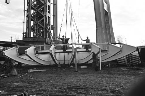 First_section_of_Space_Needle_fins_being_lifted_ca_October_28_1961.jpg