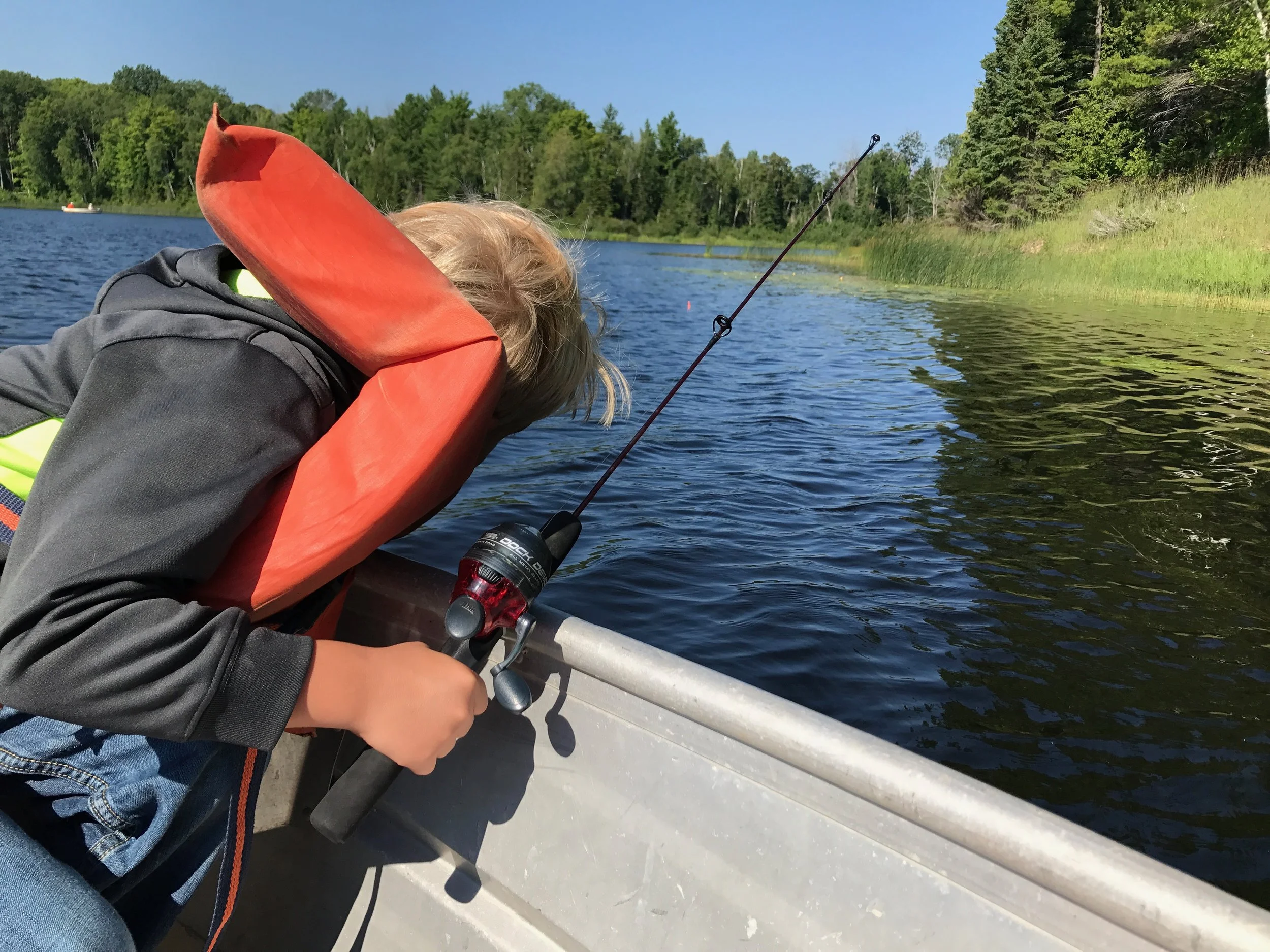 My son, bored out of his mind, right before we turned back to shore. See the bobber? Yeah, it never went under and we didn't catch a single fish :-/.