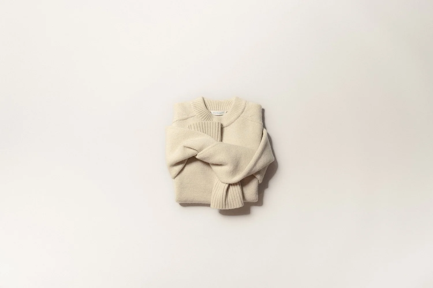 An undyed British wool saddle shoulder sweater