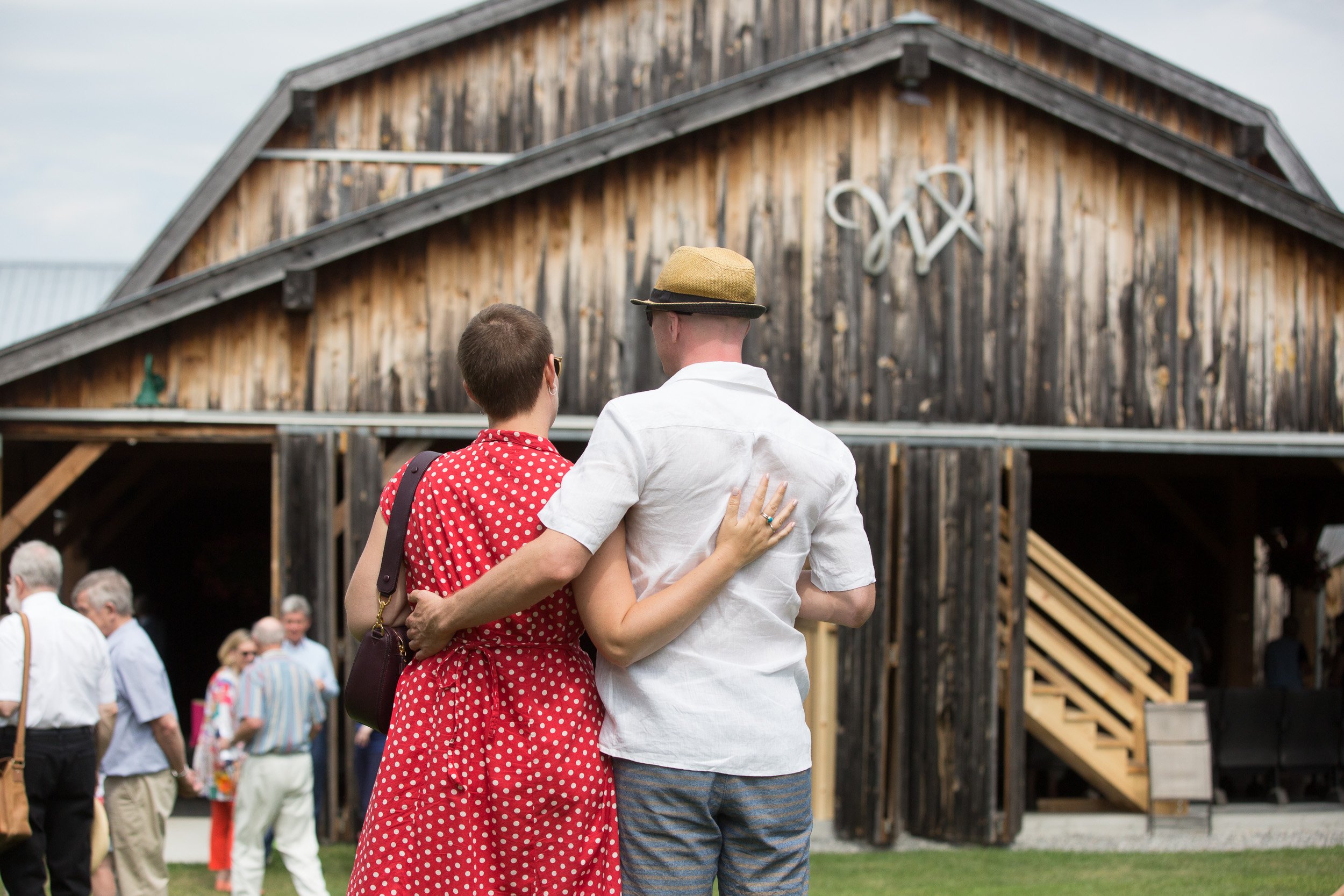 couple hugging in front of Barn WESTBEN1 Credit- Steve Dagg.jpg