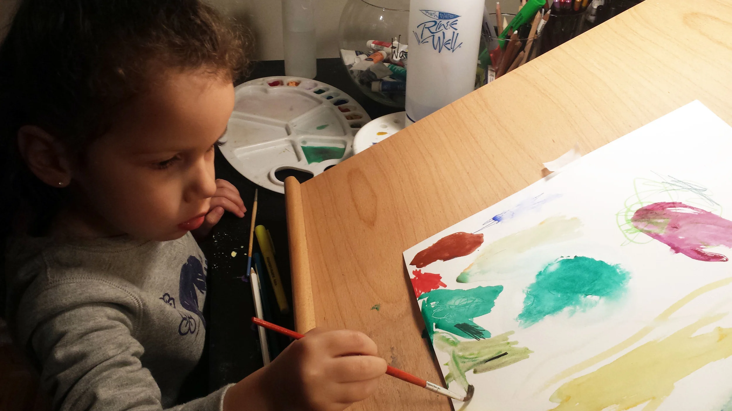 Mya concentrated on her new piece