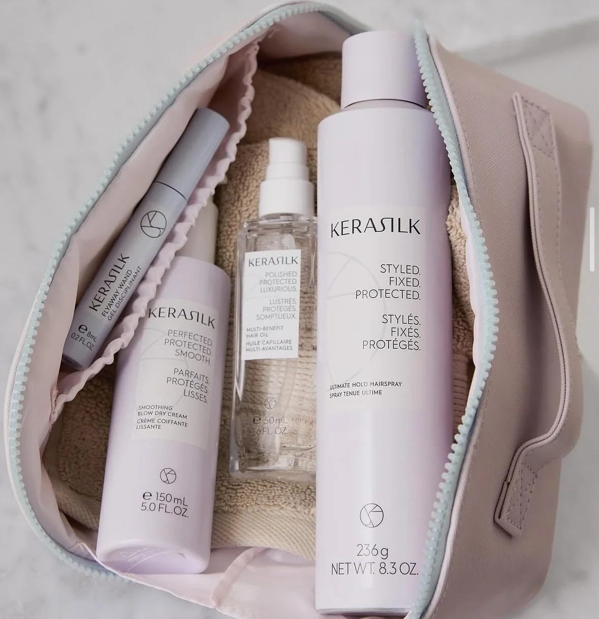 Travel in style 🧳🗺️✨

Pack with @kerasilkna to include Smoothing Blow Dry Cream, add a touch of Multi-Benefit Hair Oil for shine, tame with the award winning Flyaway Wand, and lock it in with Ultimate Hold Hairspray.

#KERASILK #KERASILKHair #hairc