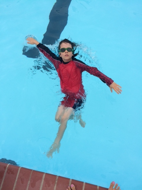 Here is a picture of Ian: Throughout the summer we were able to practice free style and backstroke. With the lessons I provided along with his hard work he gained a lot of confidence in the water. As you can see he ended making a serious splash in the water by swimming his favorite stroke, backstroke.