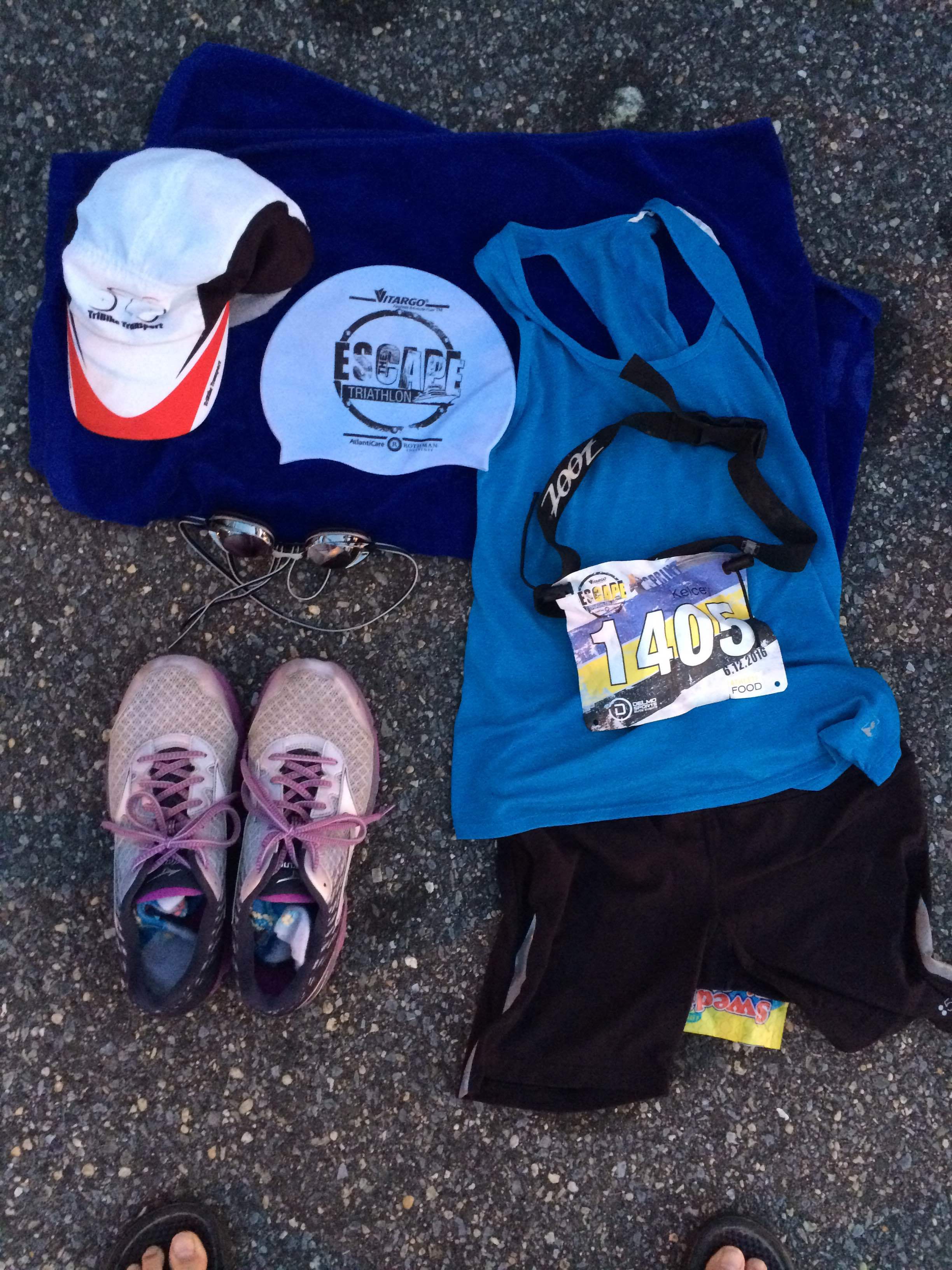 Setting out my stuff 30 minutes before my race in transition area. My bike is racked with helmet on the handles and water bottle in the holder. I am ready to tri. 