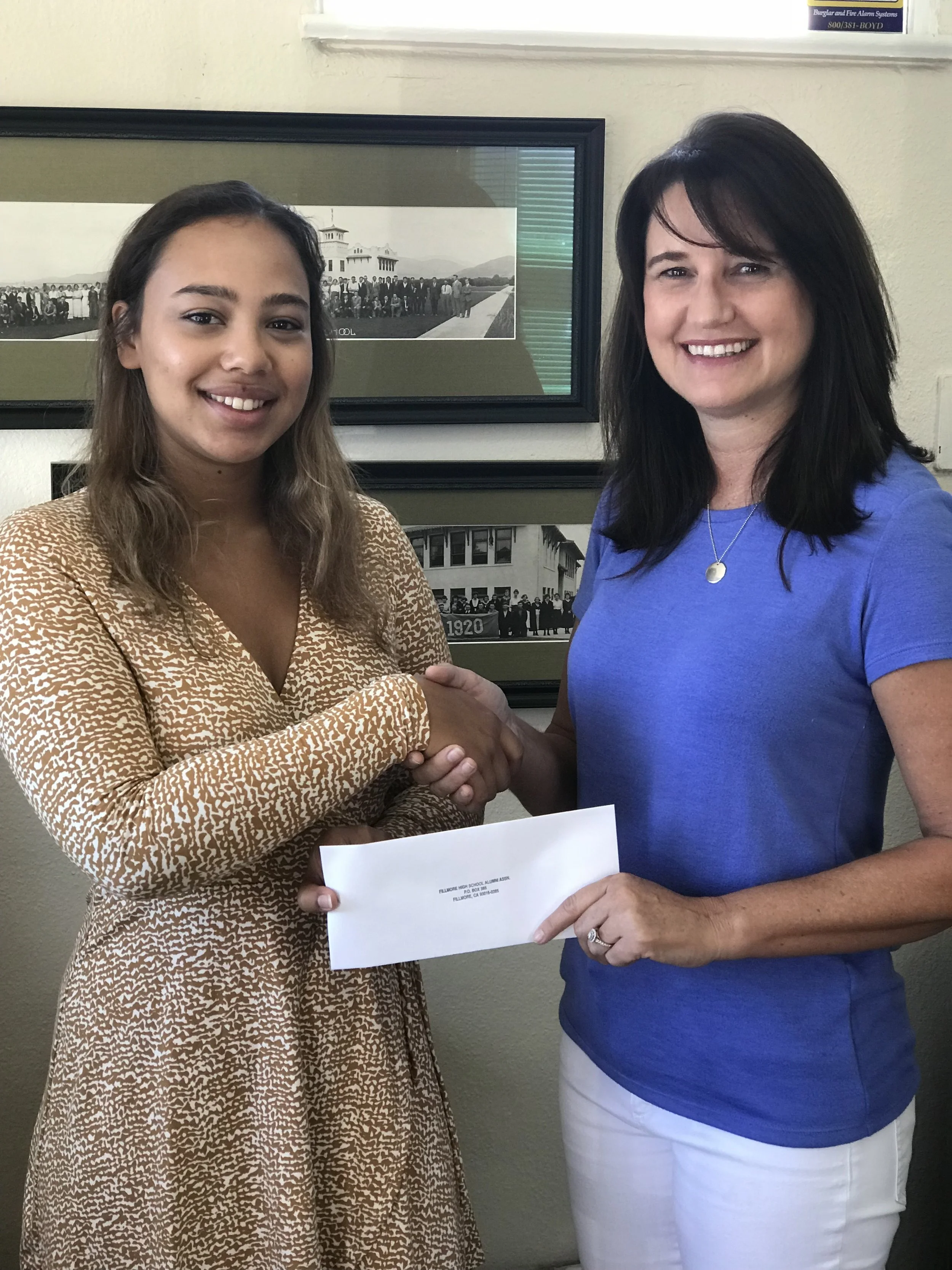 Pictured is Arlinda Reyes, FHS ‘15 receiving her Continuing Education Grant from Scholarship Committee Member, Lori “Wileman” Bennett FHS ‘85.