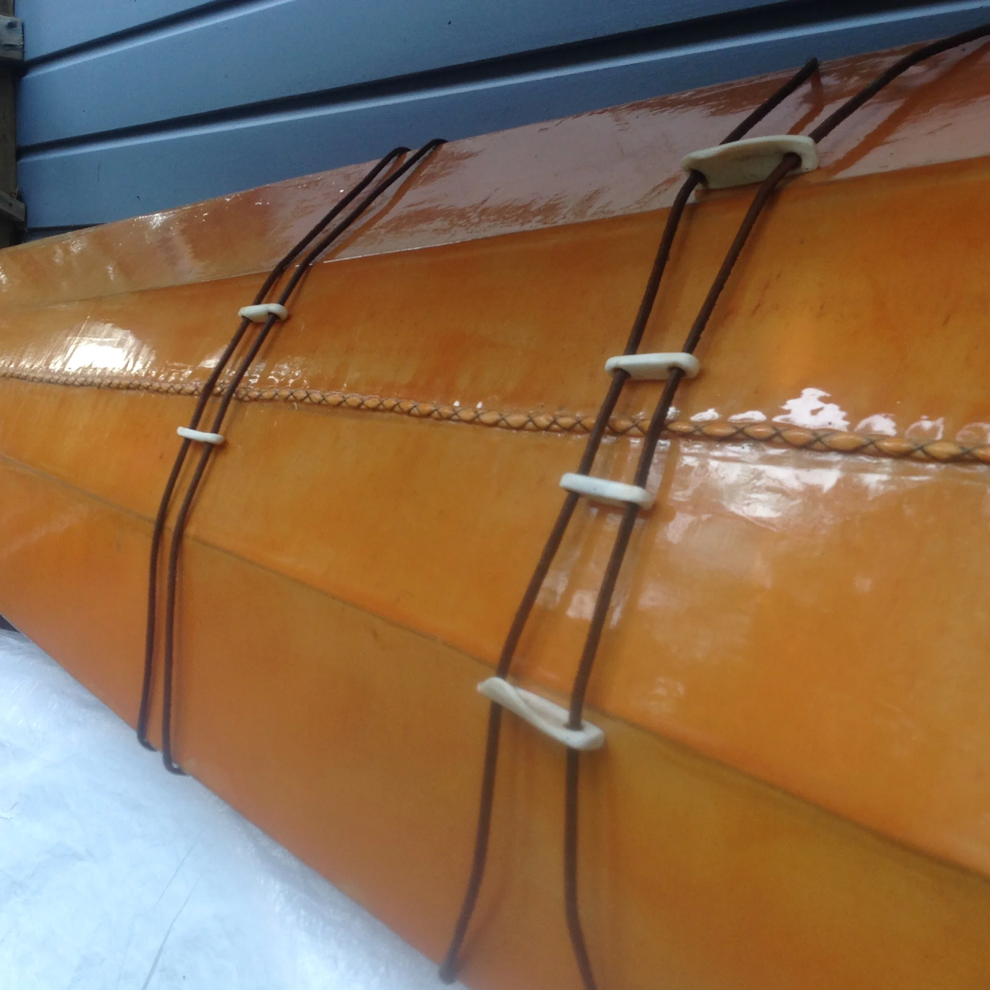 Orange 960 Earth Pigment, Leather Deck Lines, Bone Toggles, Hand Stitching.