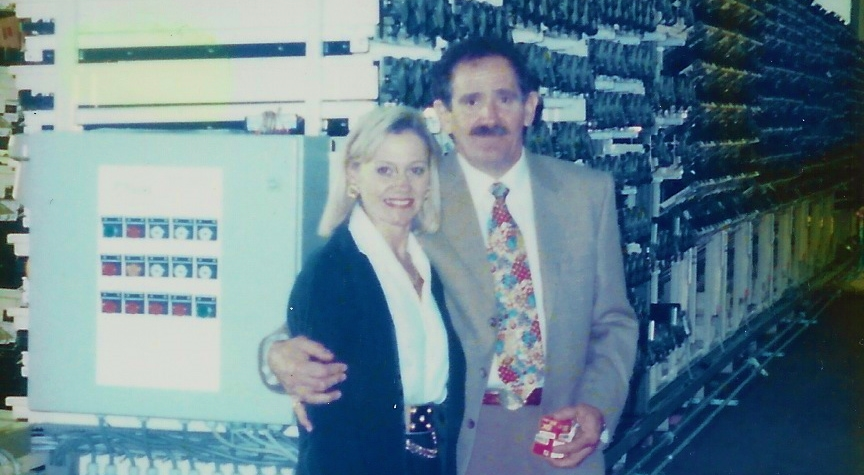 The Rivaltos standing in front of the first Smartmart store in 1996.