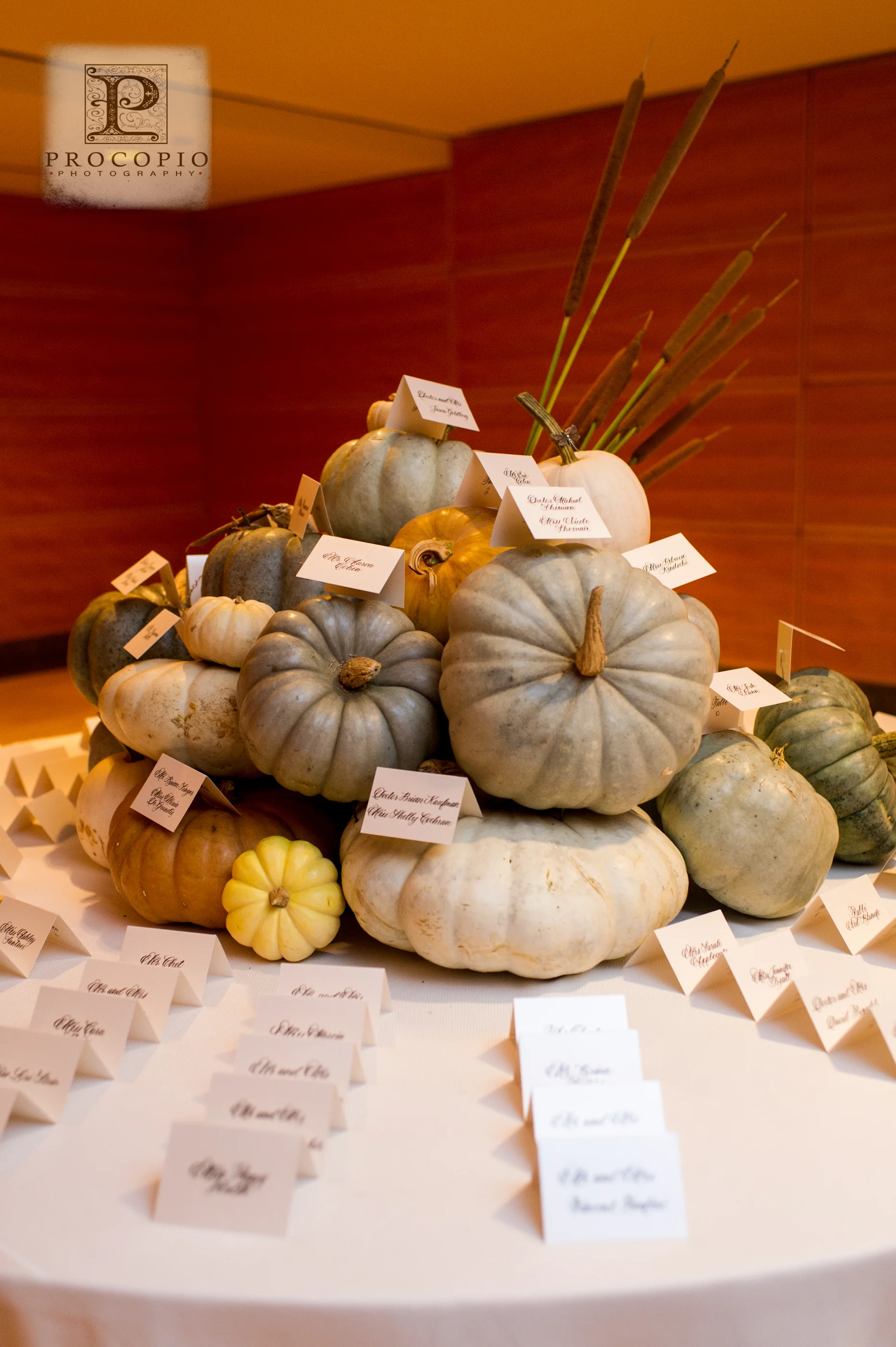 A stack of pumpkins to hold the escort cards