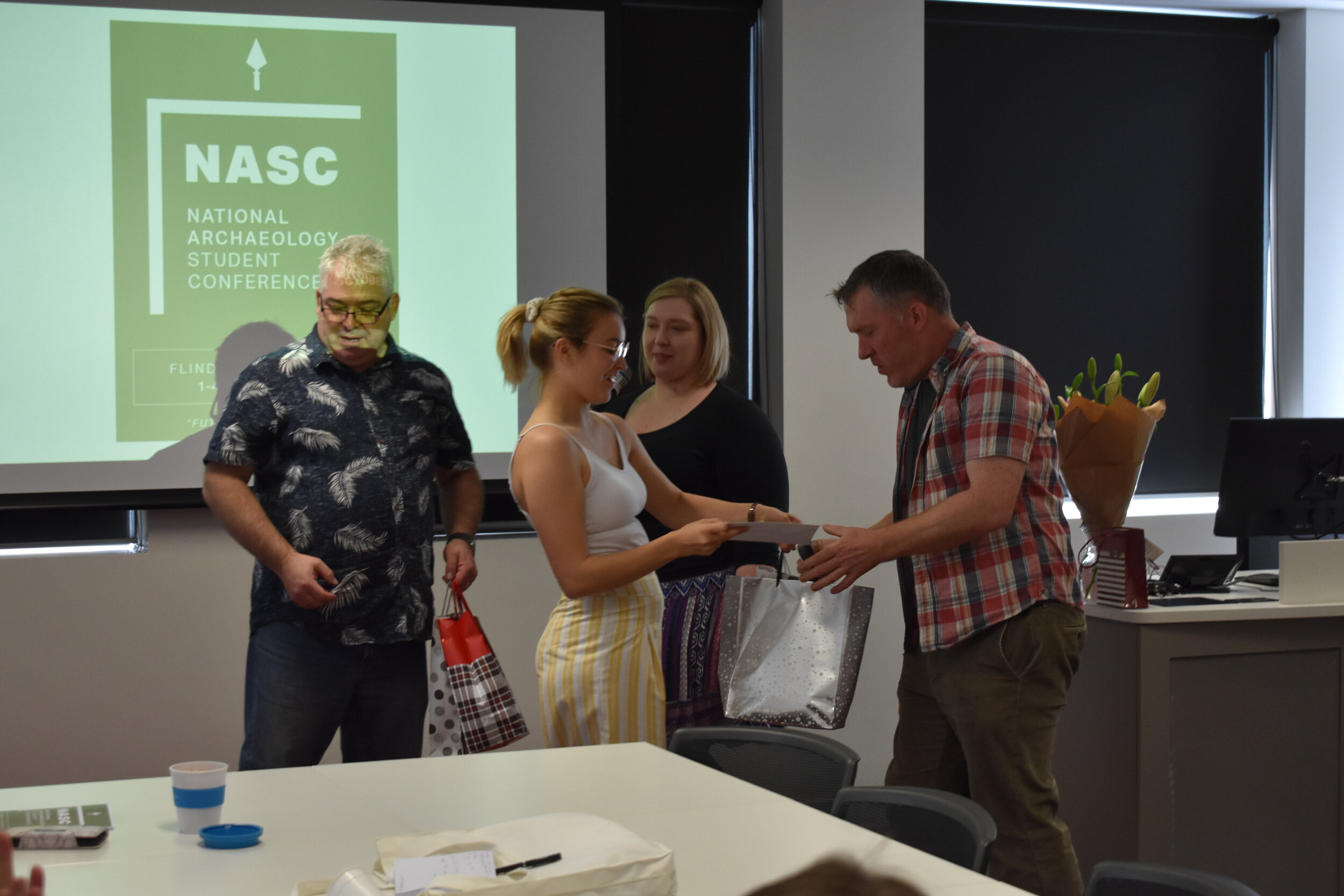 Richard Osgood receiving a thank you gift from Maeghan Stace, NASC Secretary