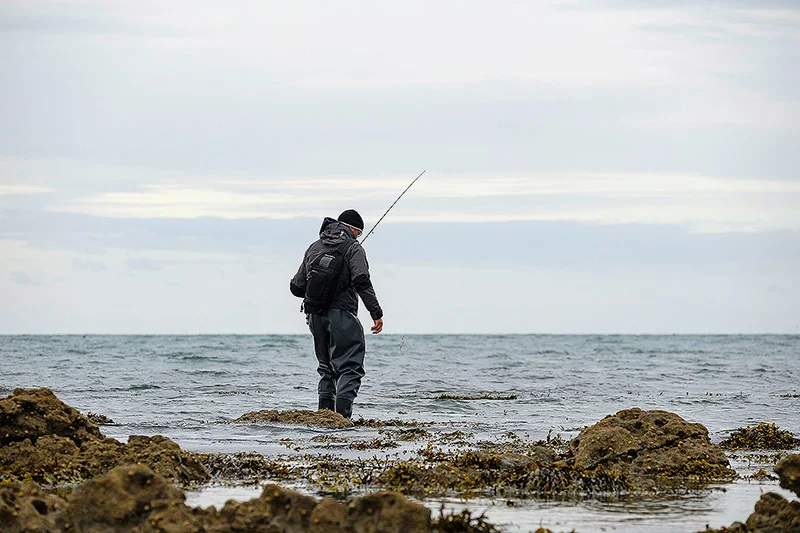 At least ankle-deep yet he strides purposefully like a mermaid