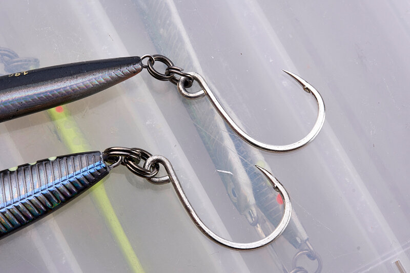 How about using two big single hooks on hard lures in the surf