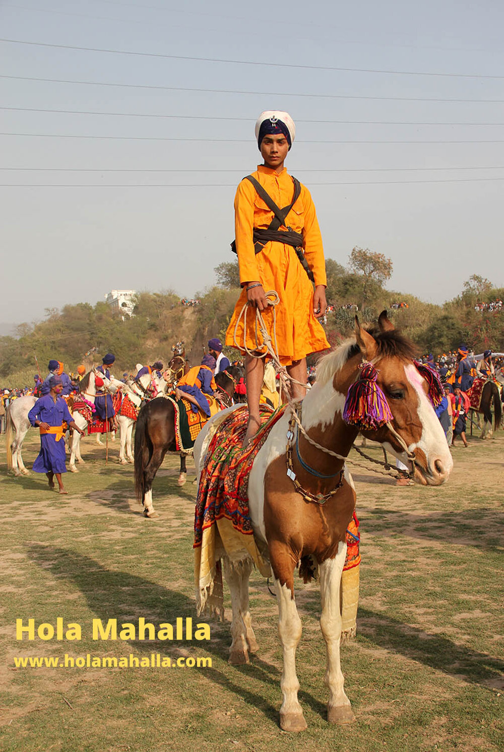 WM IMG_4589 kid stood on a horse in orange auto contrast crop.jpg