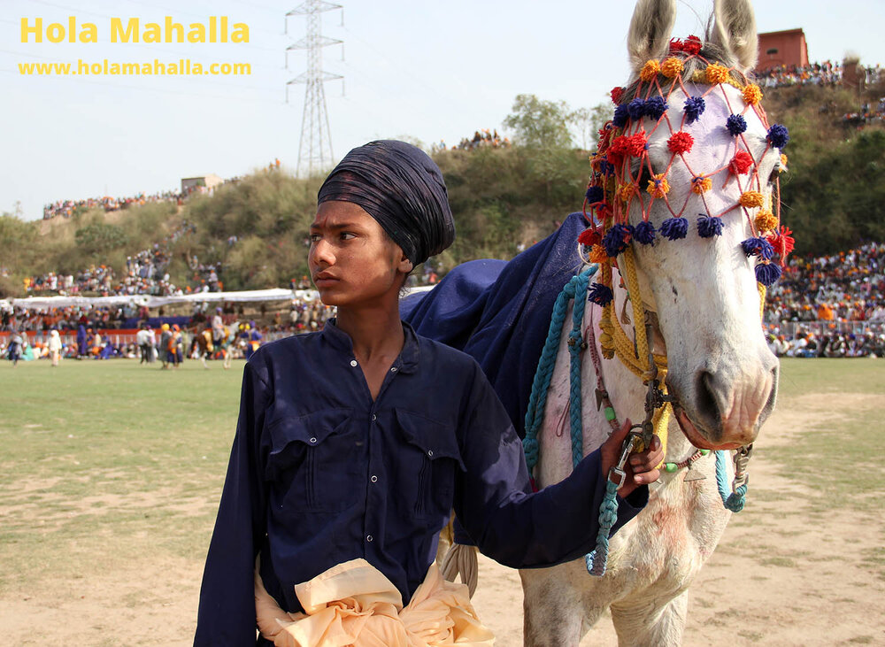 WM IMG_4506 Singh kid with horse cowd in background auto contrast crop.jpg