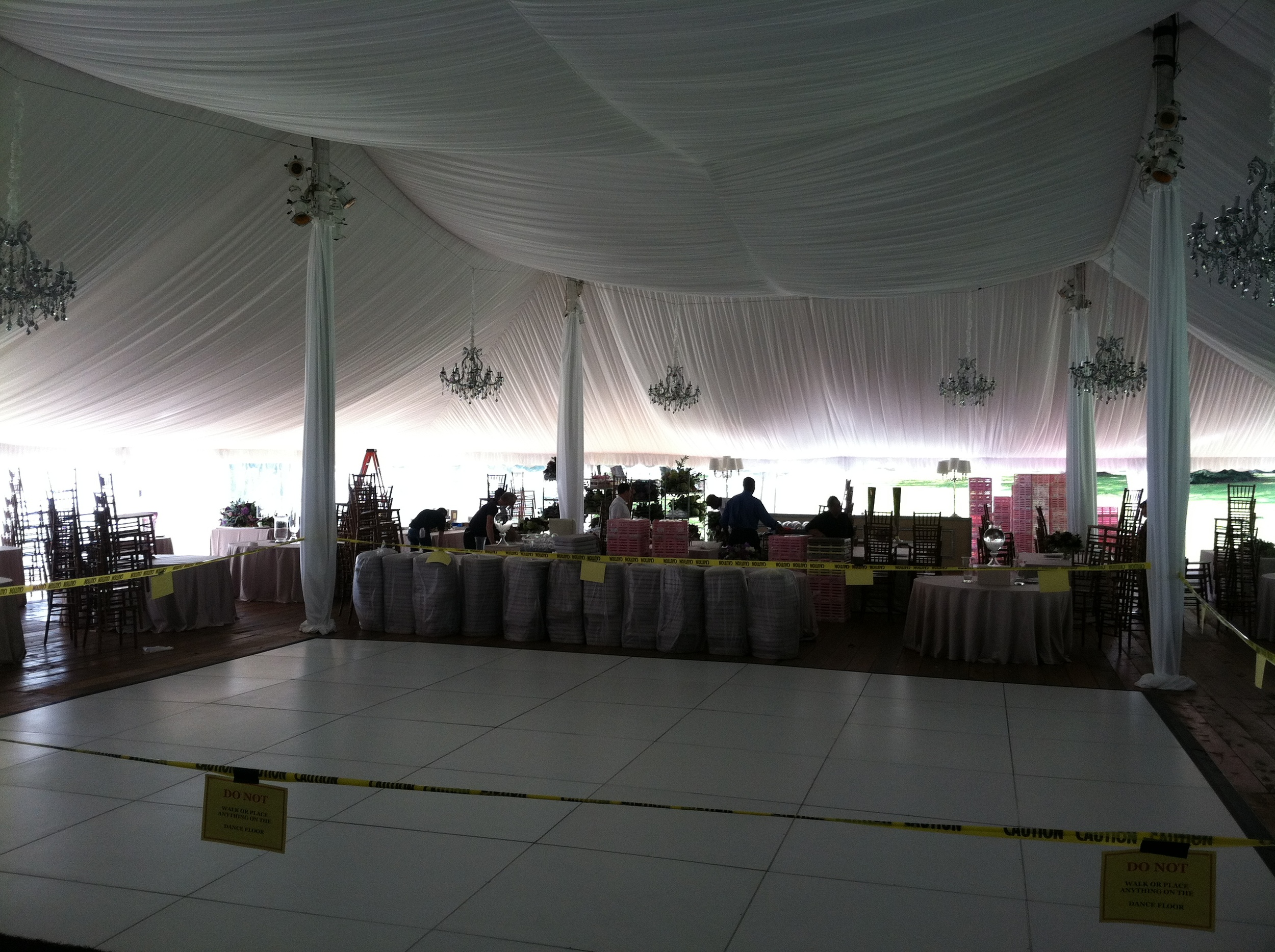 Furniture and white pleated tent liner are installed