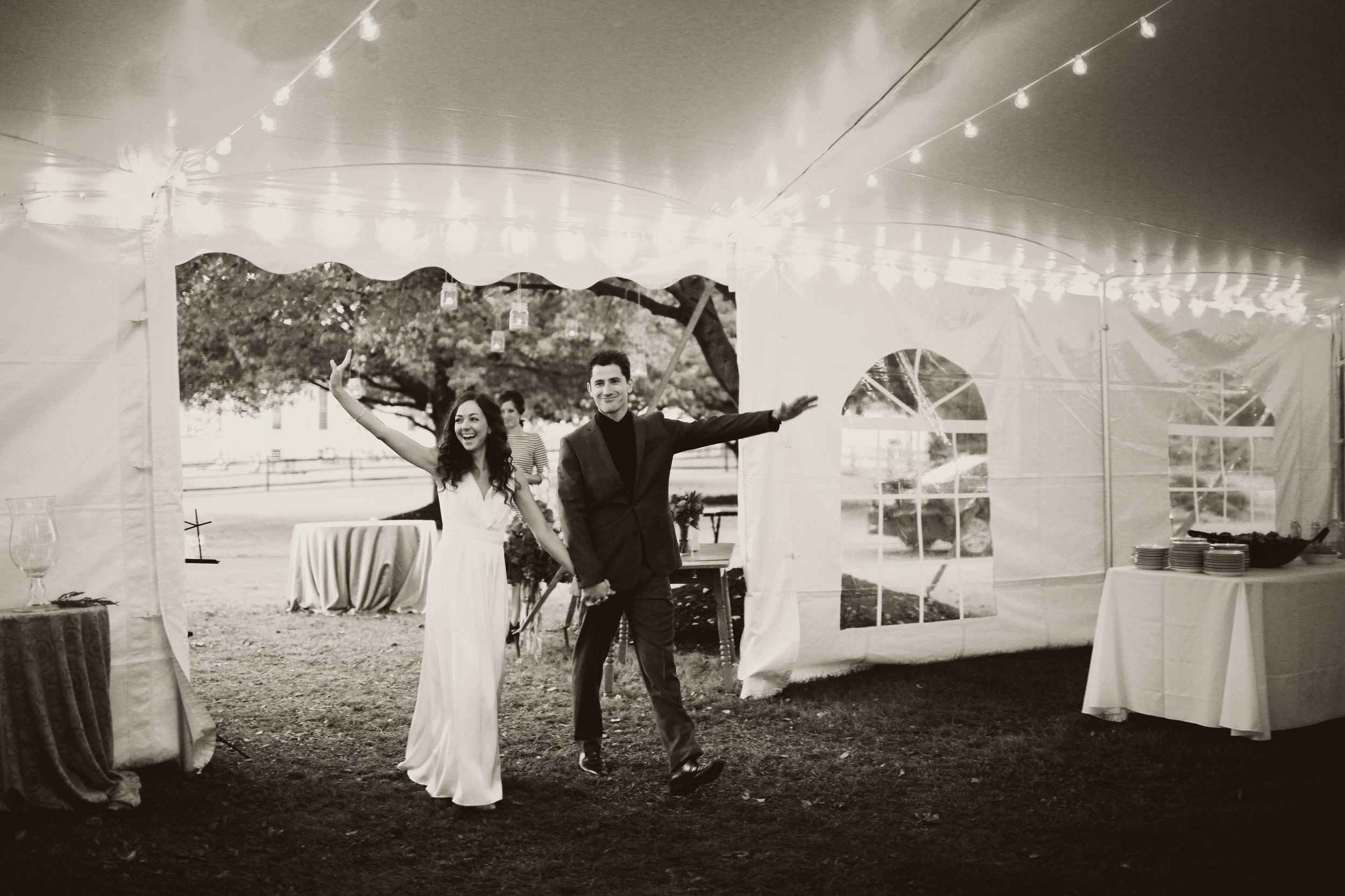 White wedding tent with cafe lights and cathedral window sidewall