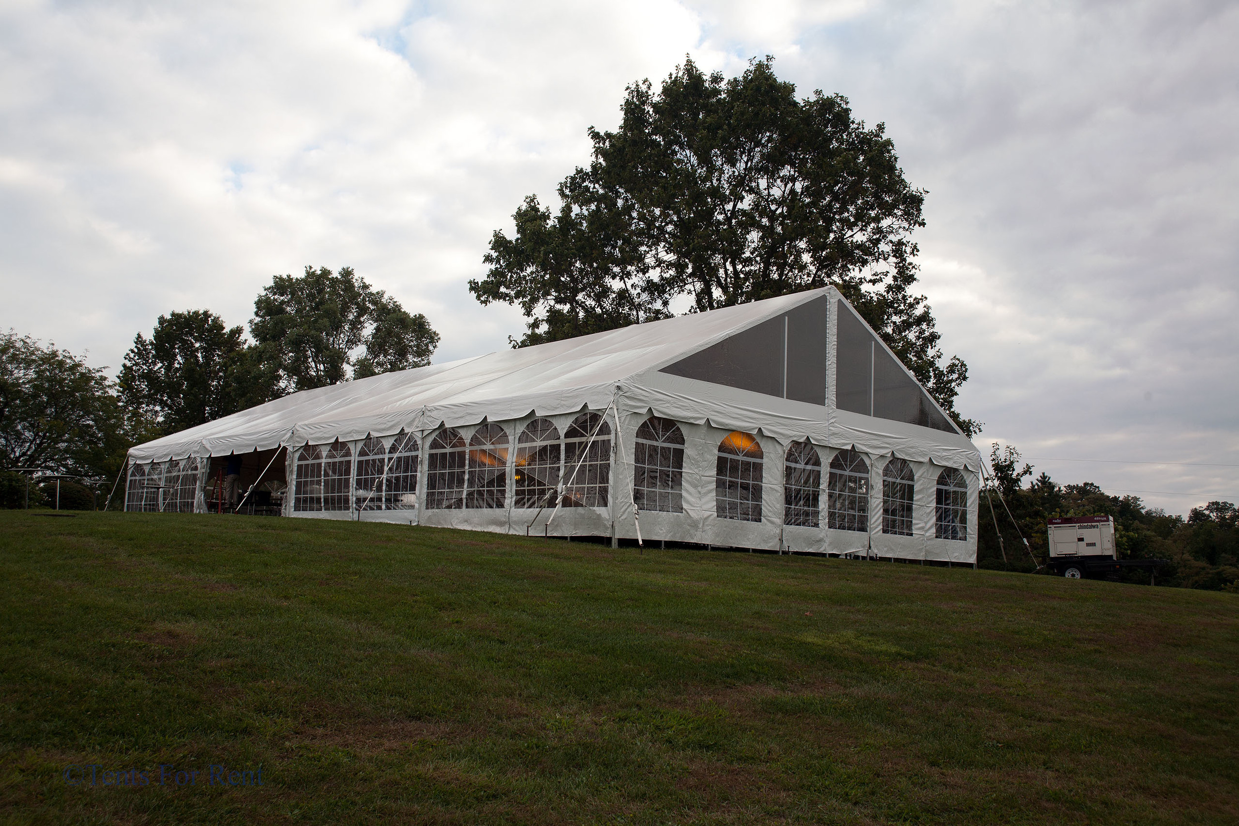 White frame tent with window sidewall