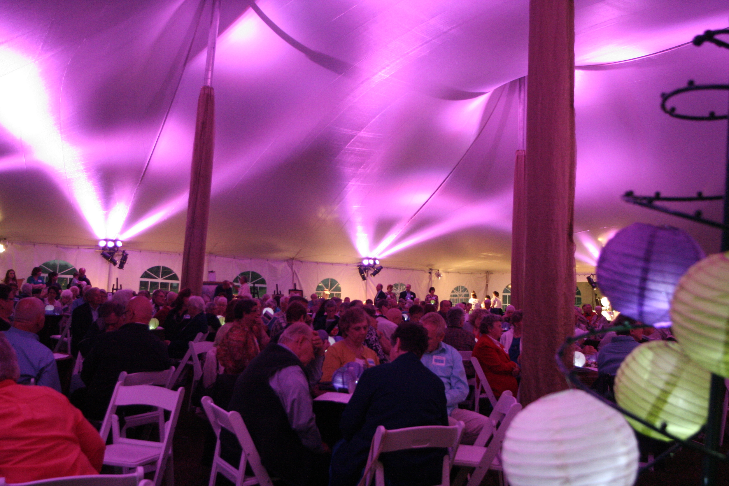 Rental tent with tables, chairs and lighting