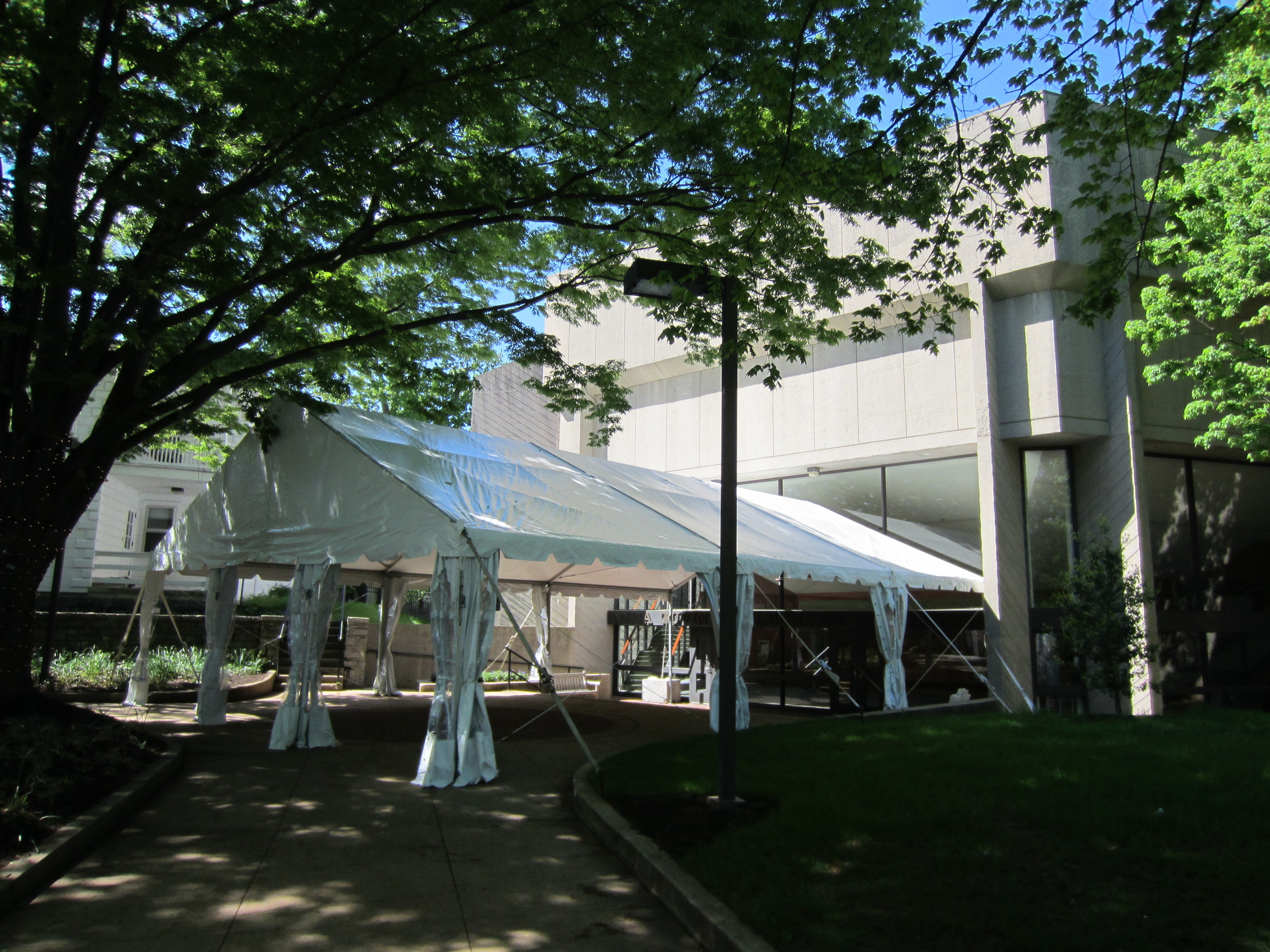 Tent as on a concrete building entranceway