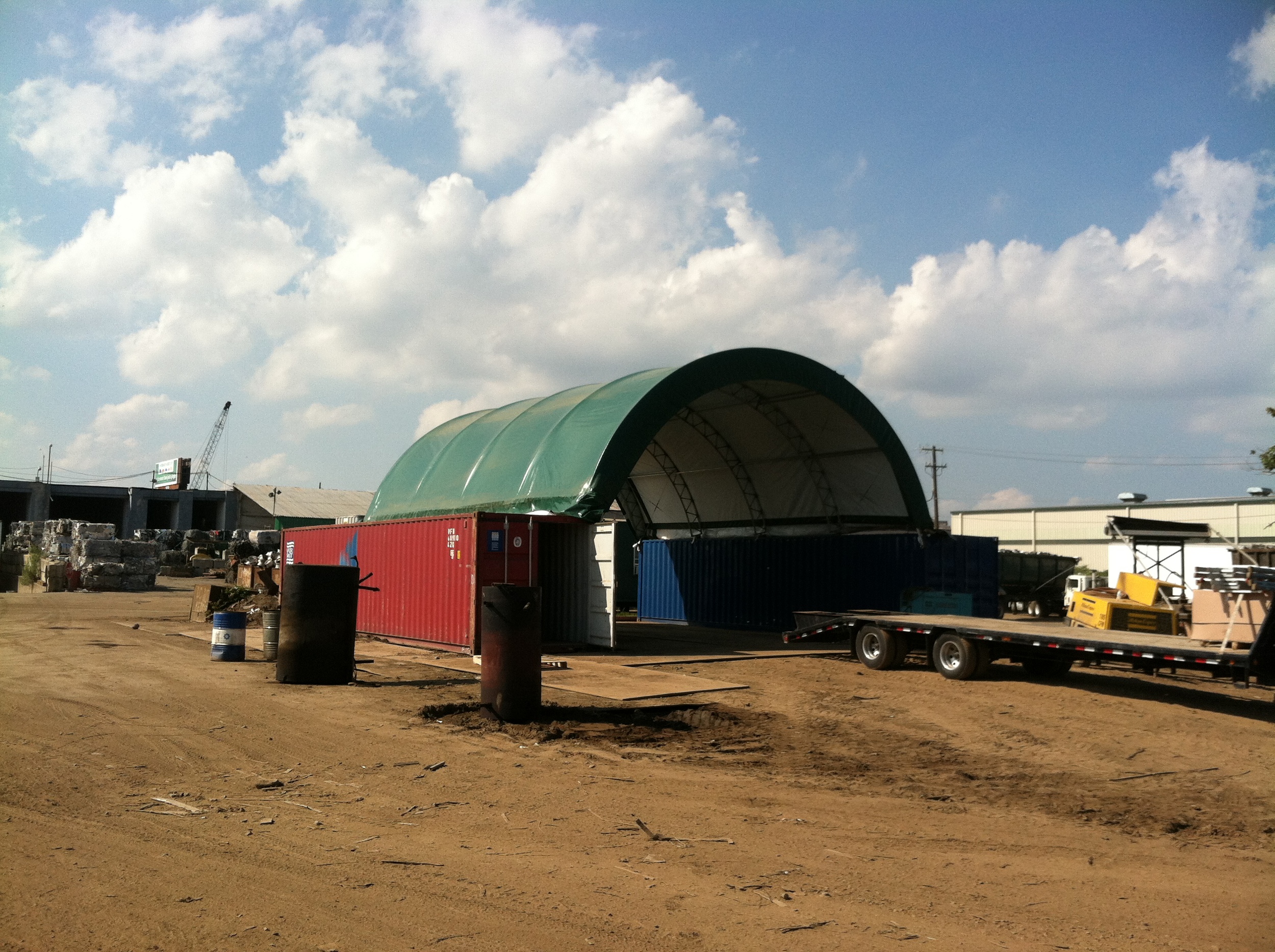 Tent fastened to shipping containers