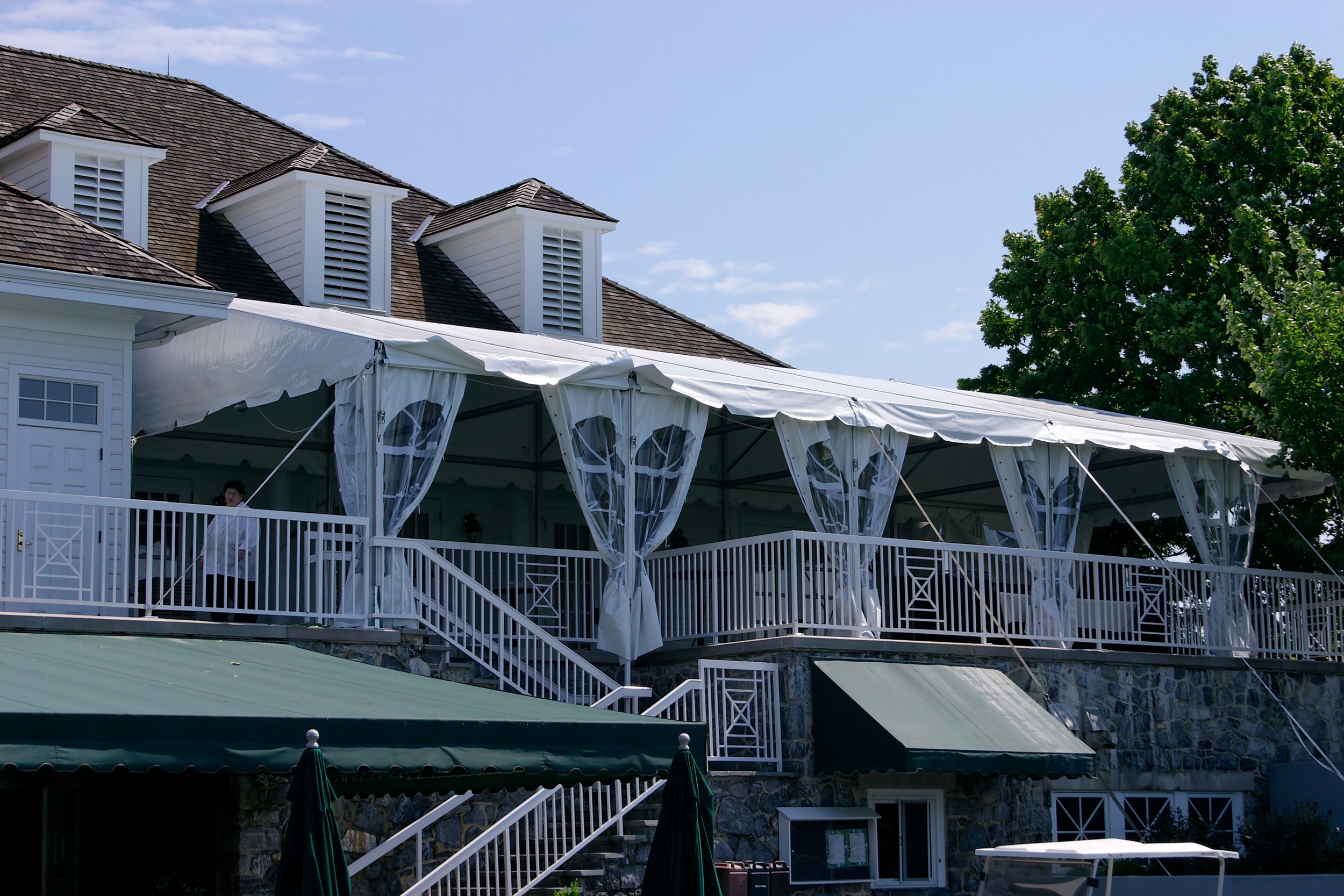 Tent on a second story patio as a restaurant