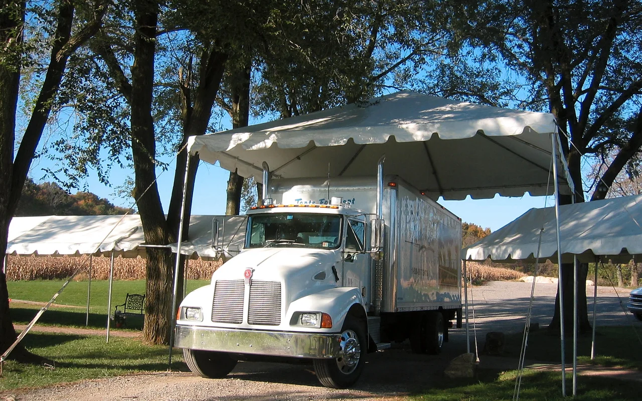 Tent over a vehicle entrance