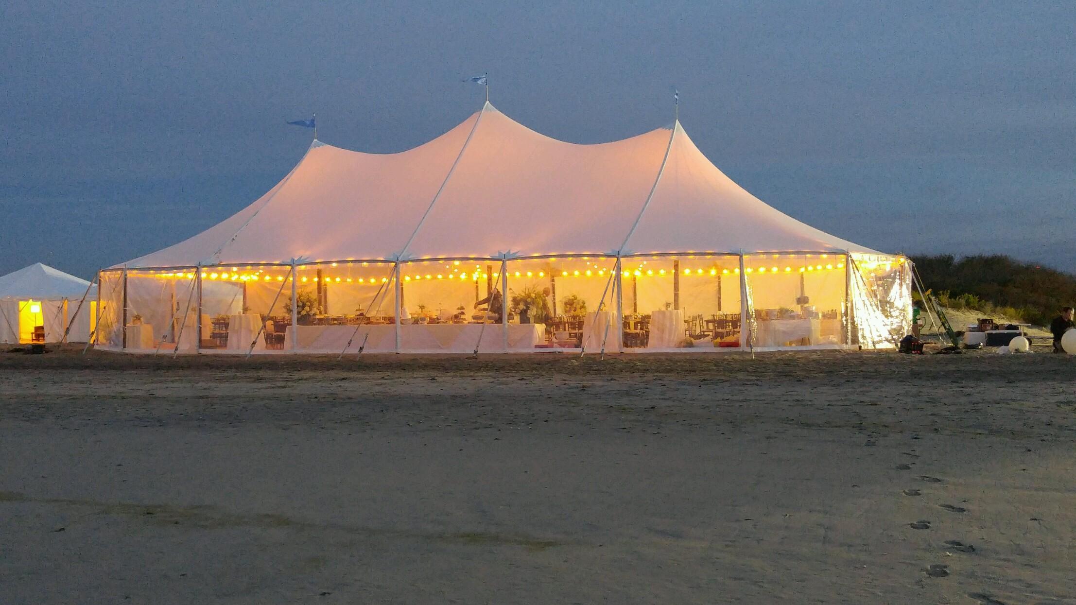 Lights on a sheer top wedding tent