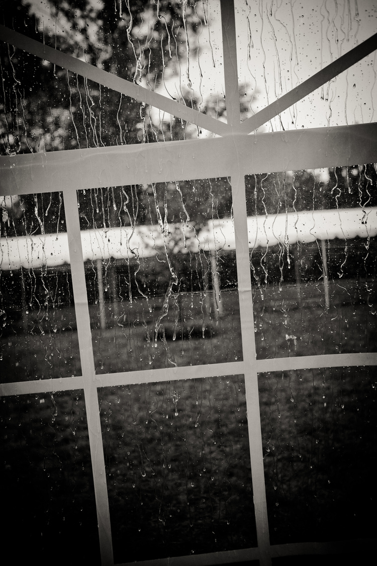 Rain on a tent window during the wedding