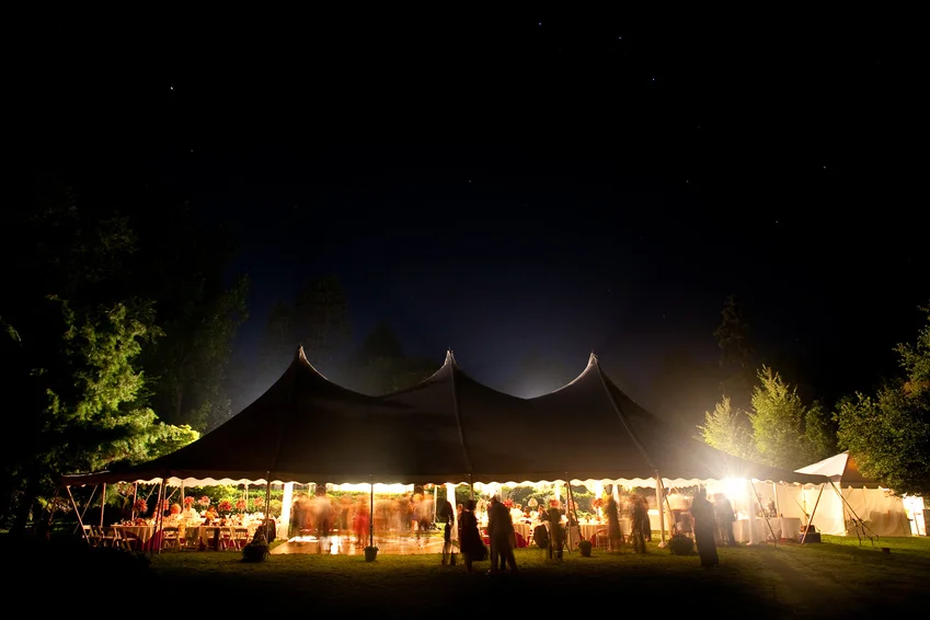 Night time wedding tent with stars visible.
