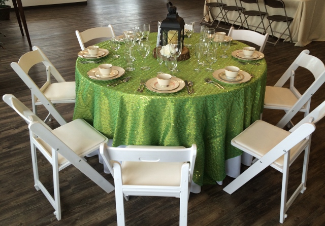 Round table with white padded garden chairs