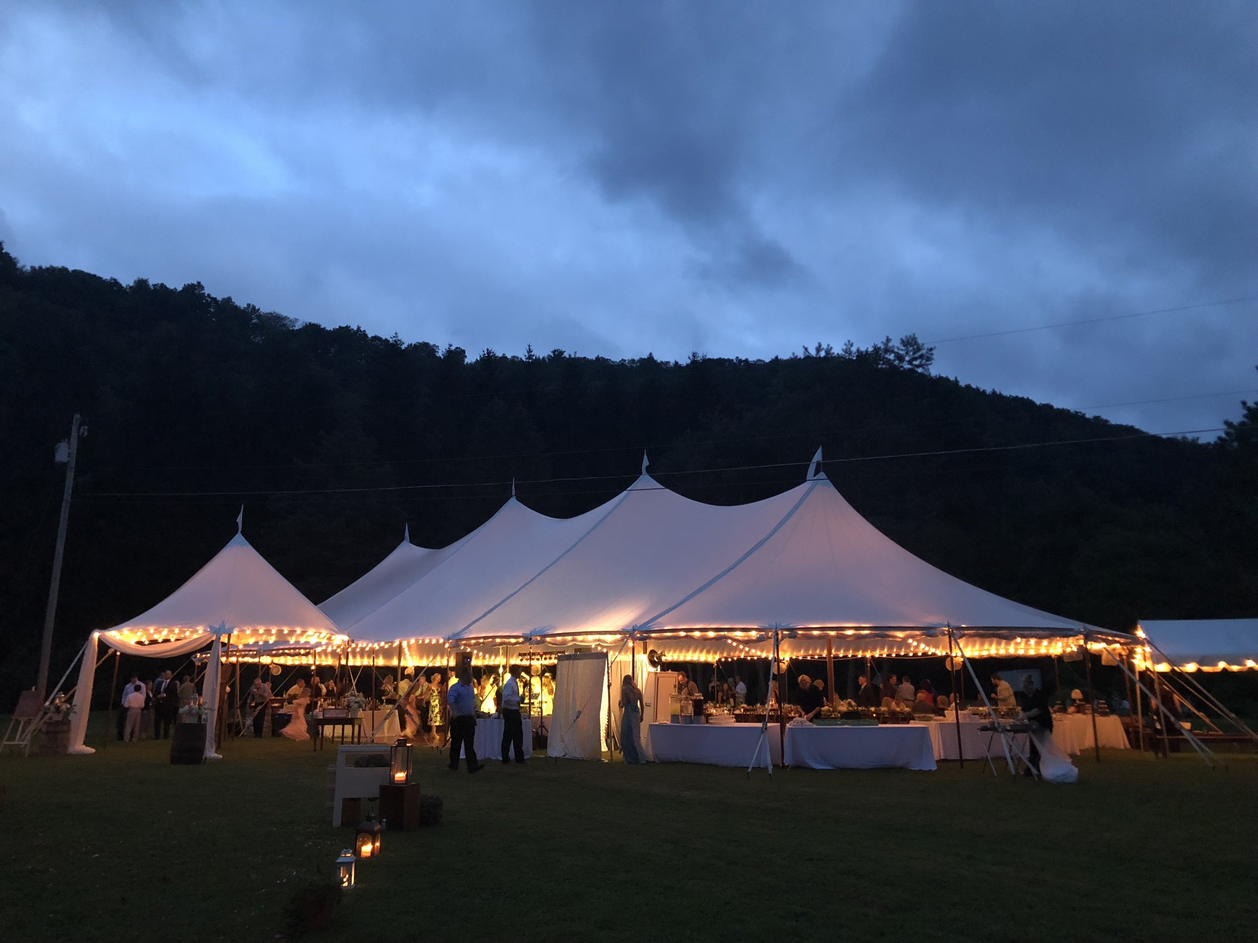 Evening romantic, rustic wedding in a sailcloth tent