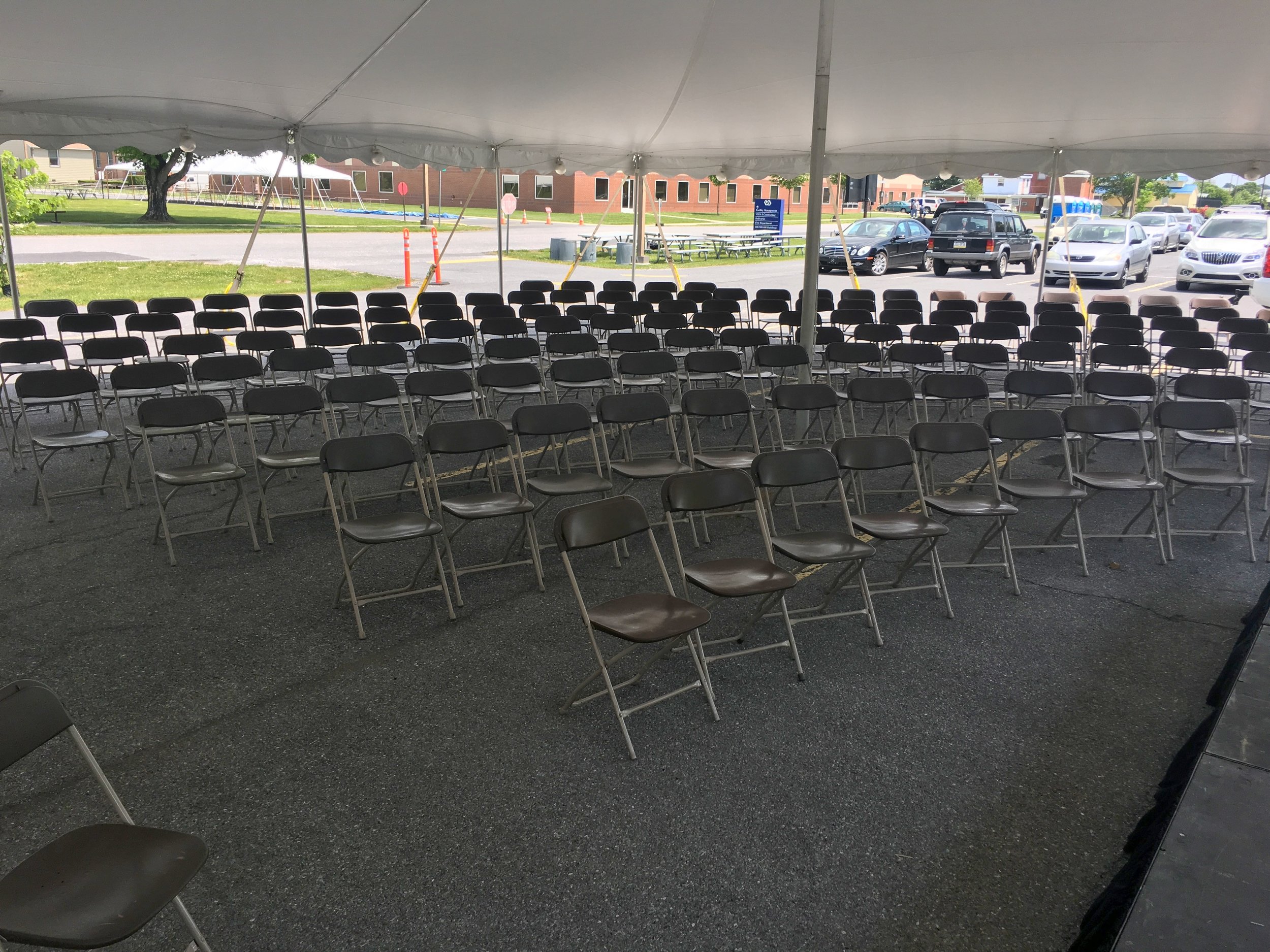 Brown folding chairs for rent for your outdoor tent events