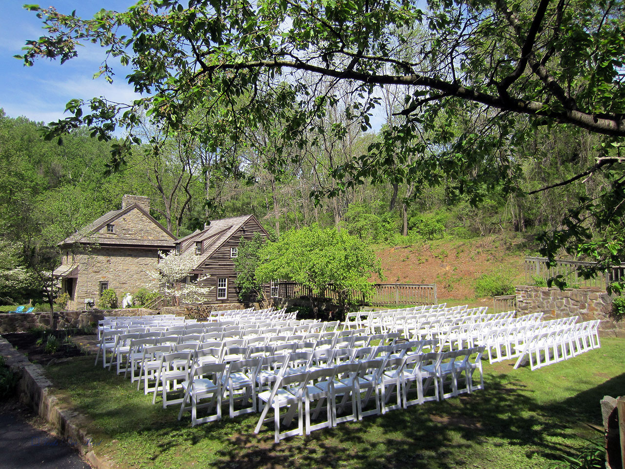 White padded folding garden chairs for your outdoor ceremony