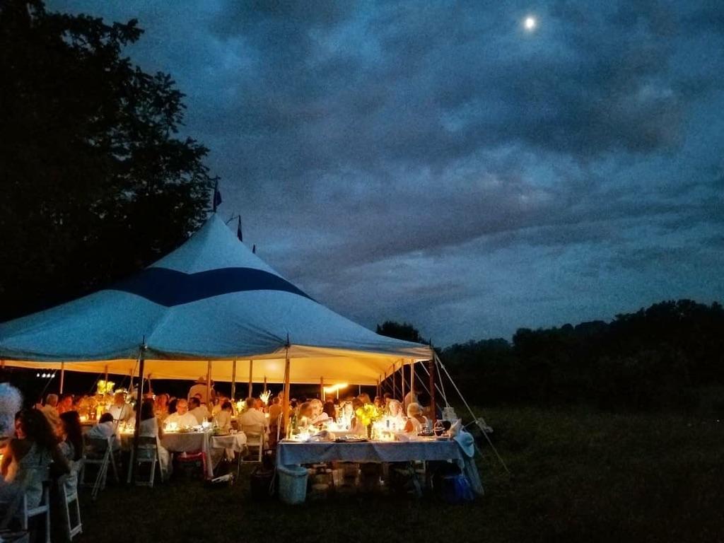 30x50 blue striped tent night.jpeg