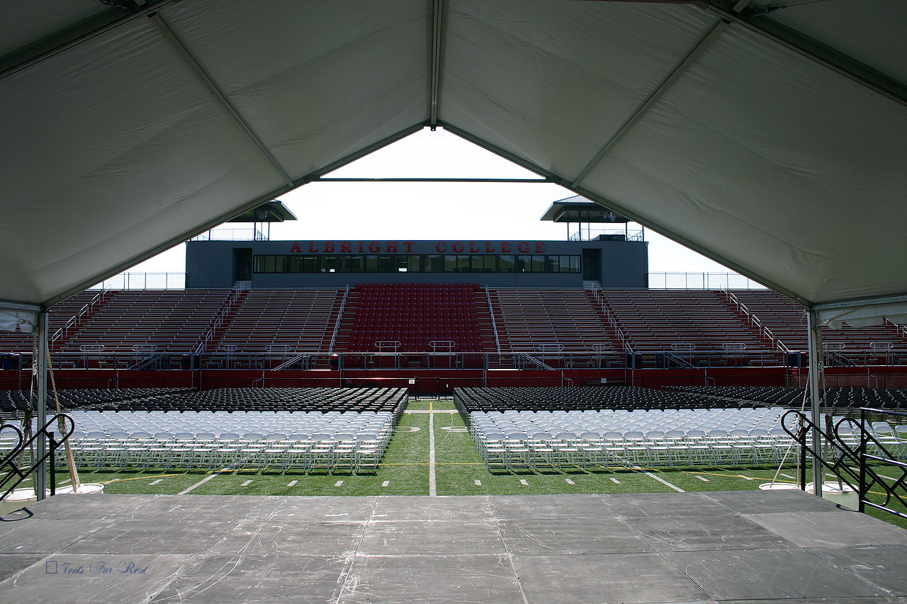 College graduation stage and tent