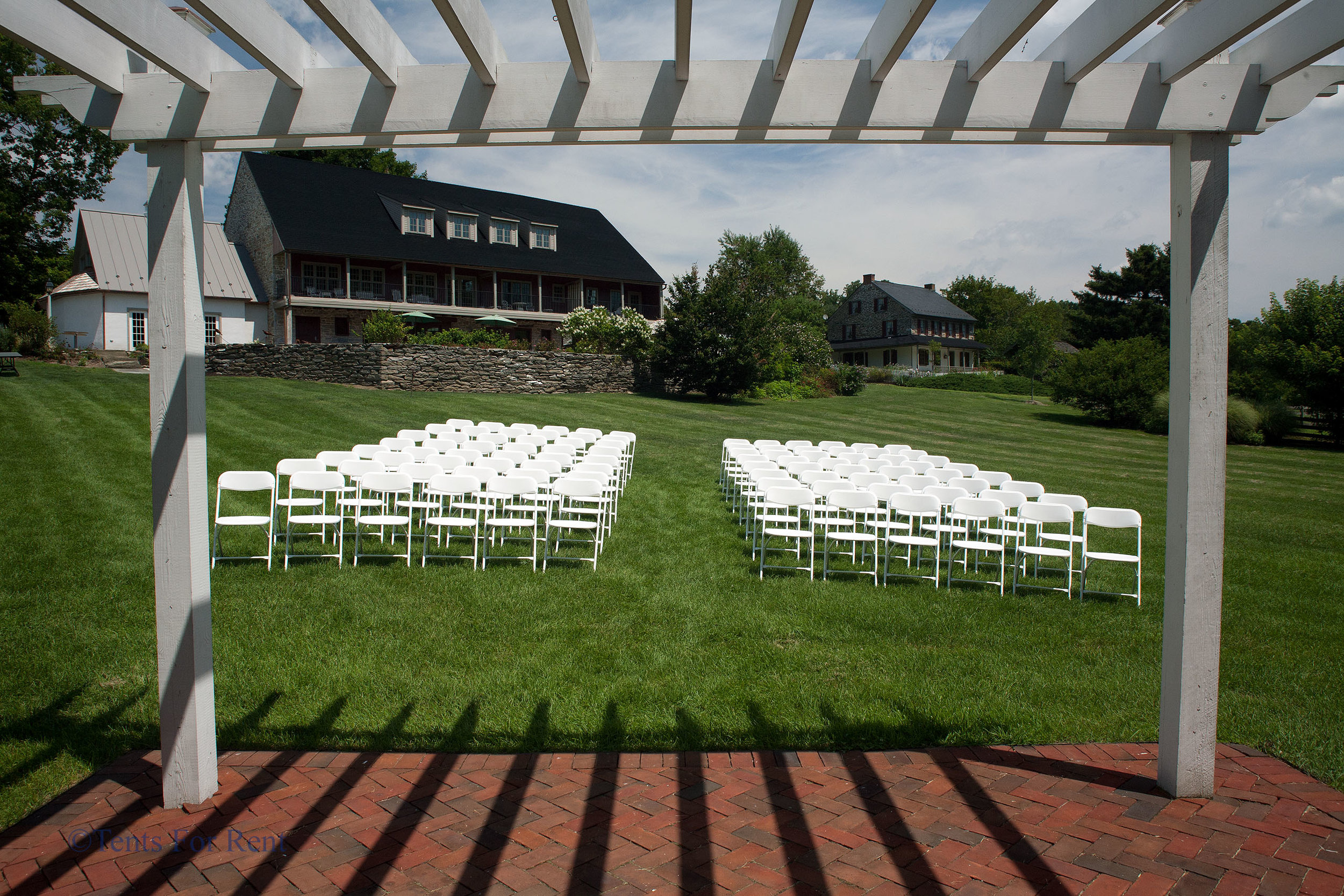 Comfortable white folding chairs for rent in Coatesville, PA