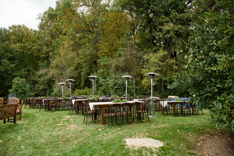 Outdoor wedding reception with farm tables