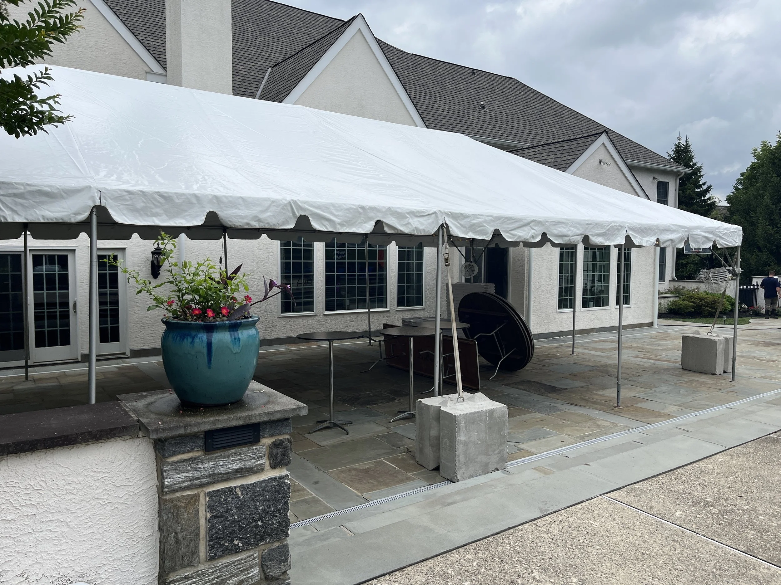 1,100-pound concrete weights for a tent on a patio